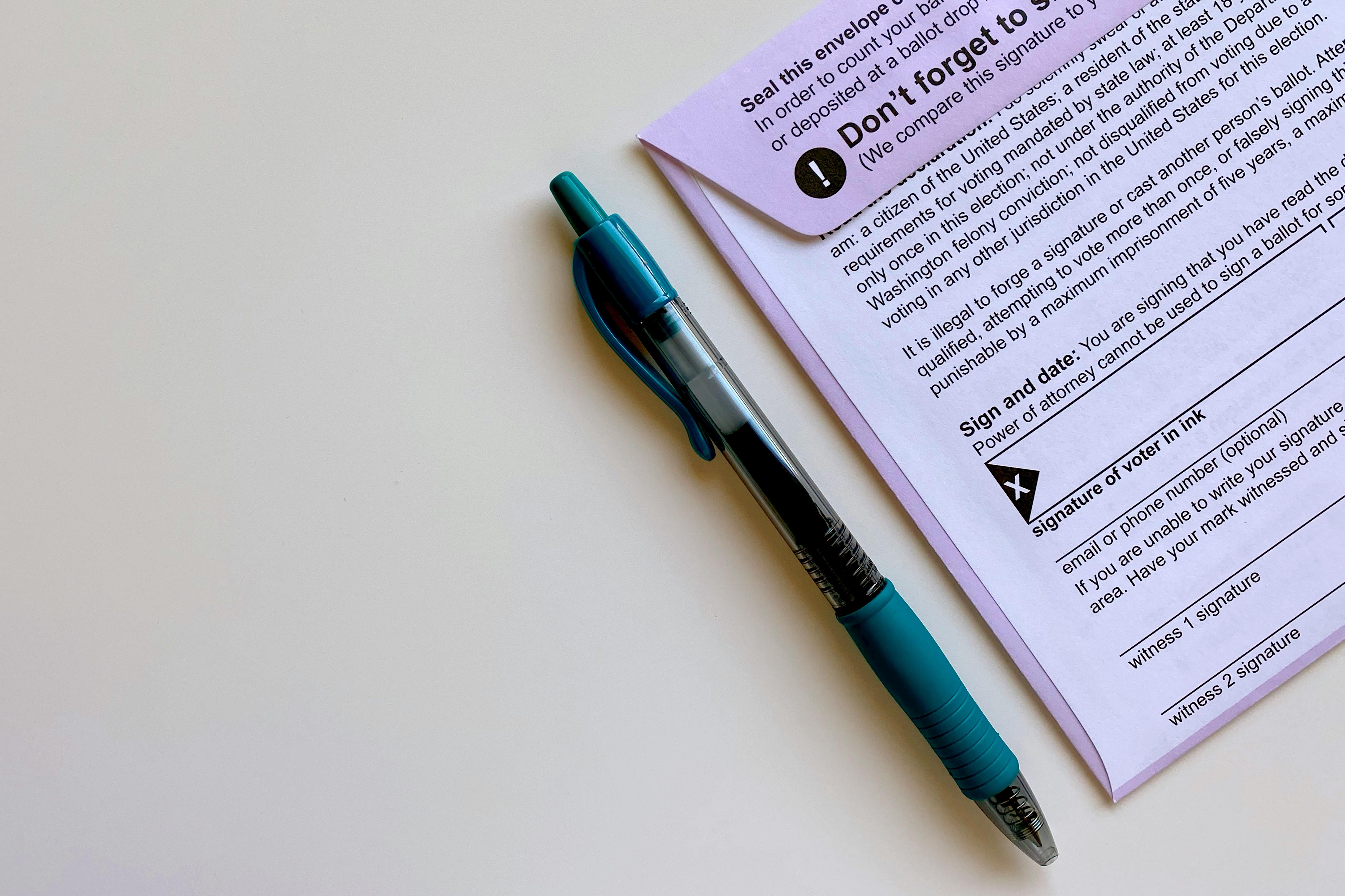 Paper ballot and pen on a desk