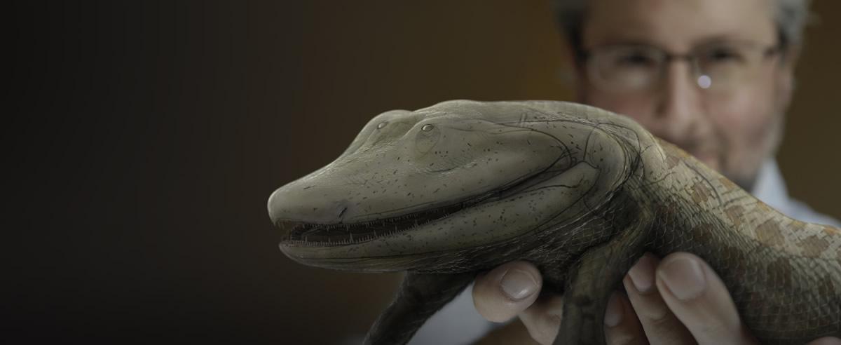 Neil Shubin holding a model of a Tiktaalik