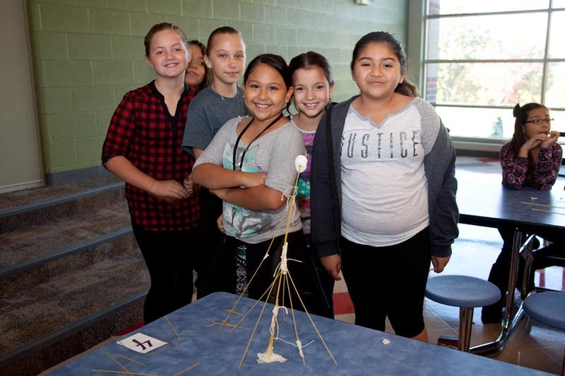 A group of students created the tallest water tower out of marshmallows and dry spaghetti.