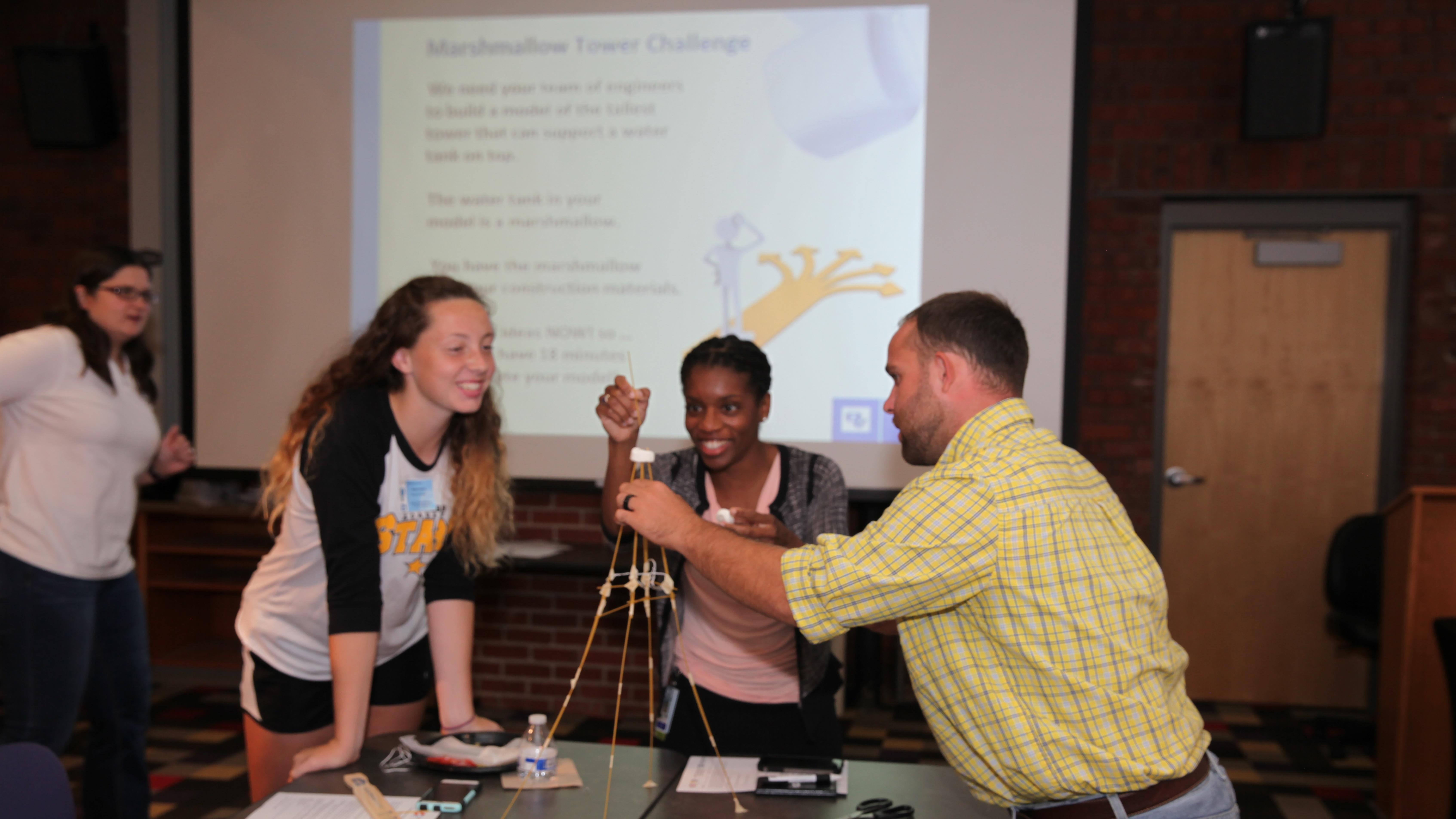 Students construct a toothpick marshmallow tower