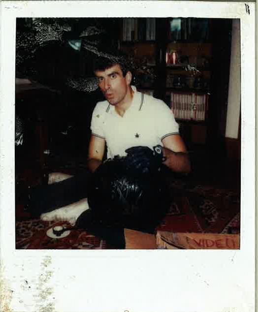 Old picture of a young man holding a ball of tape