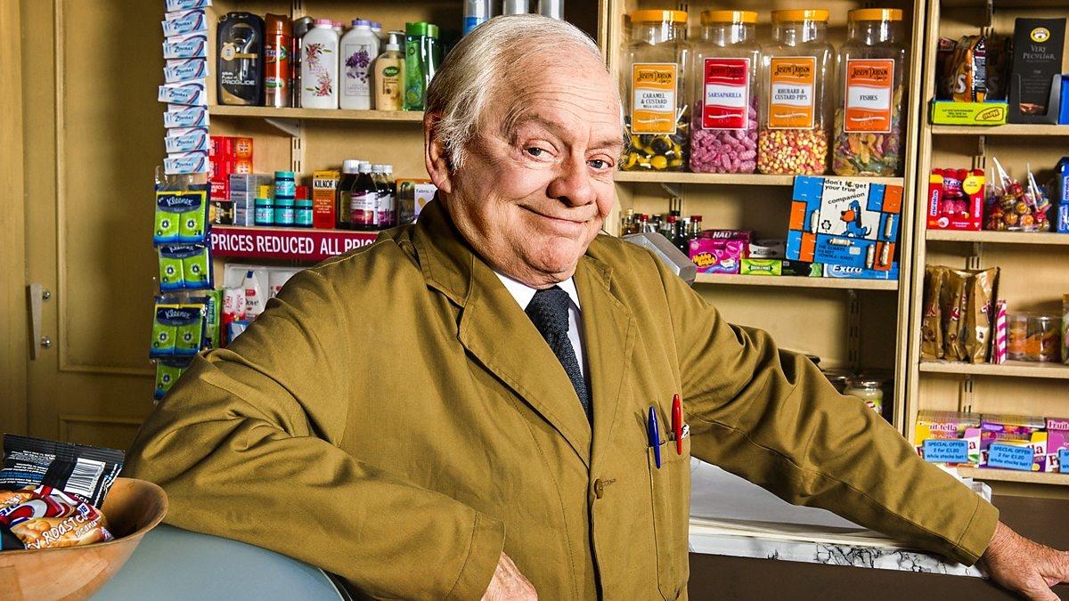 Still Open All Hours - Man smiling at grocery counter