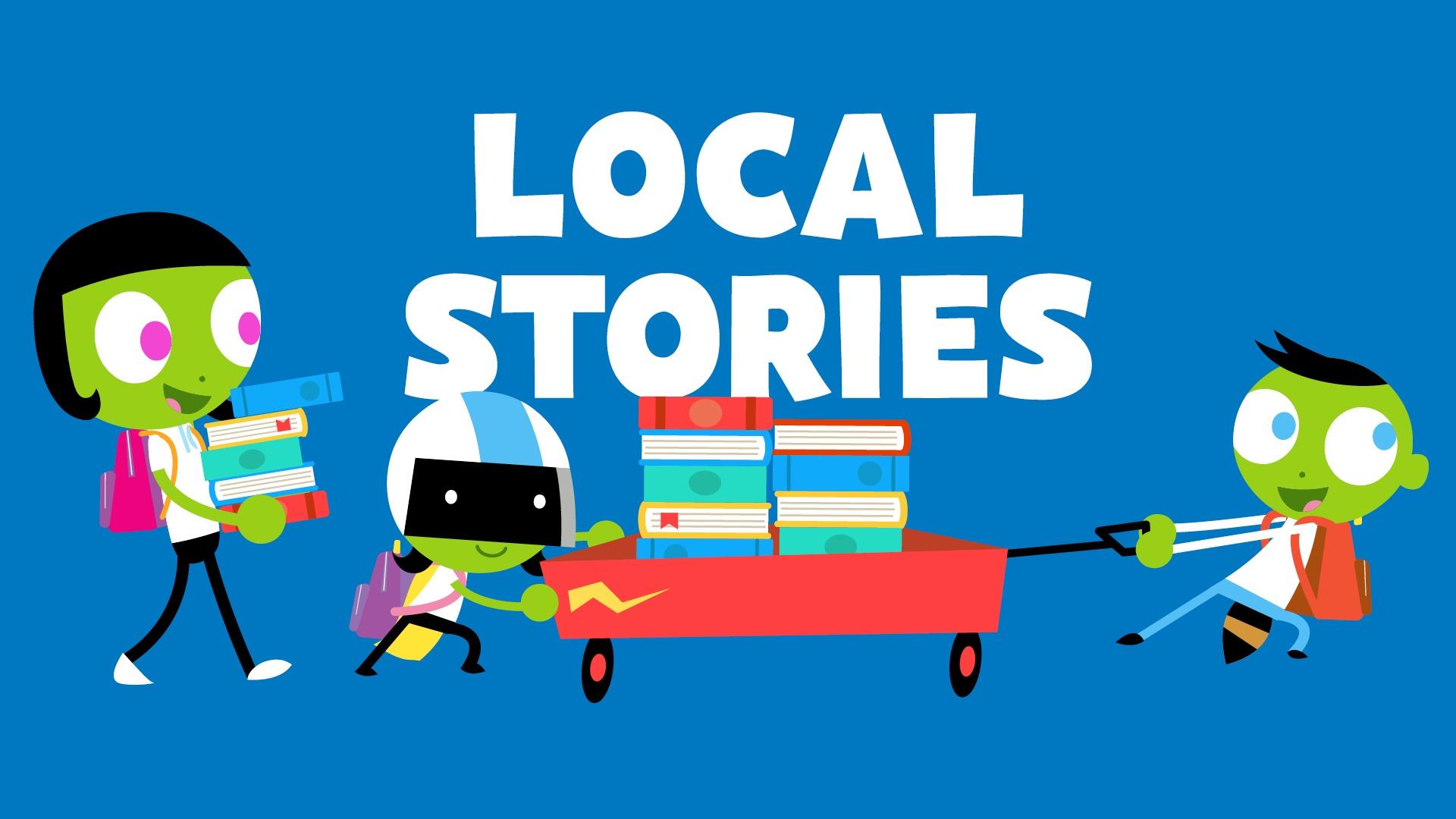 Local Stories - Dash and Dot and friend pull wagon filled with books