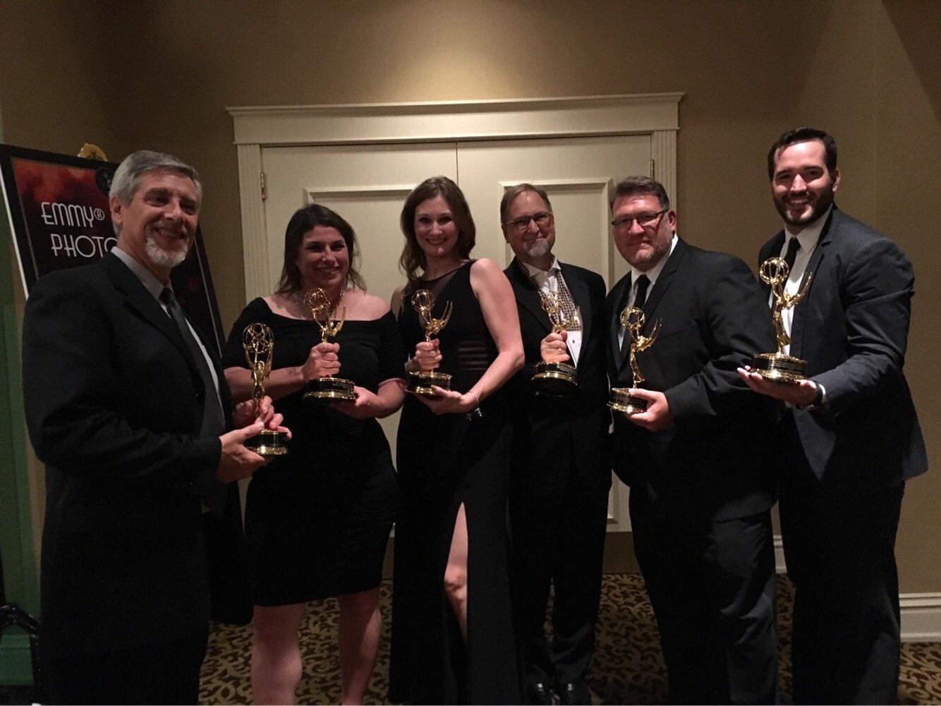 Part of the KCPT gang with their golden statuettes. We're proud of the work we're doing in and for the community.