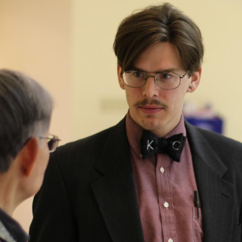 Photo of a man looking at a woman
