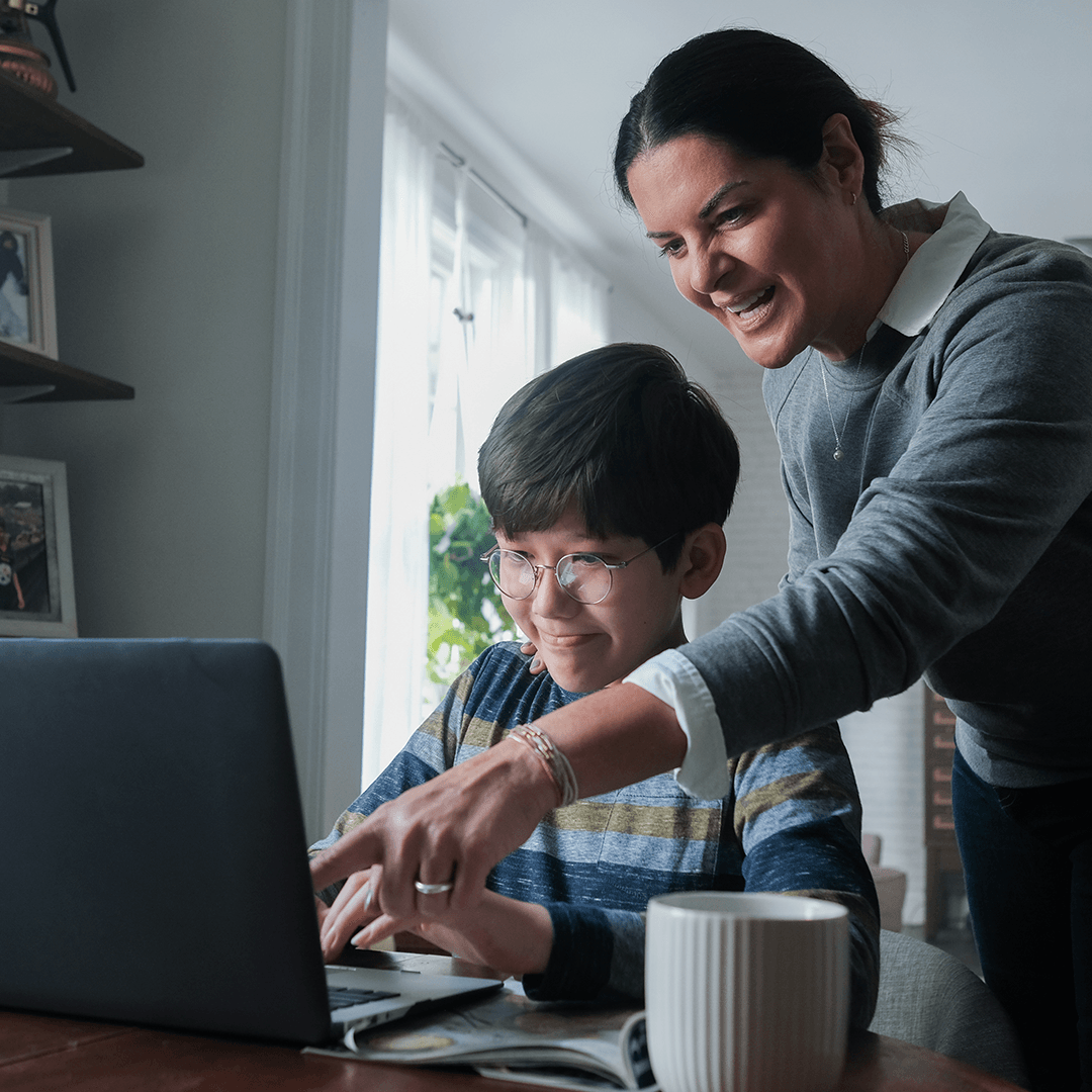 Learning At Home - Parent helps kid with distance learning