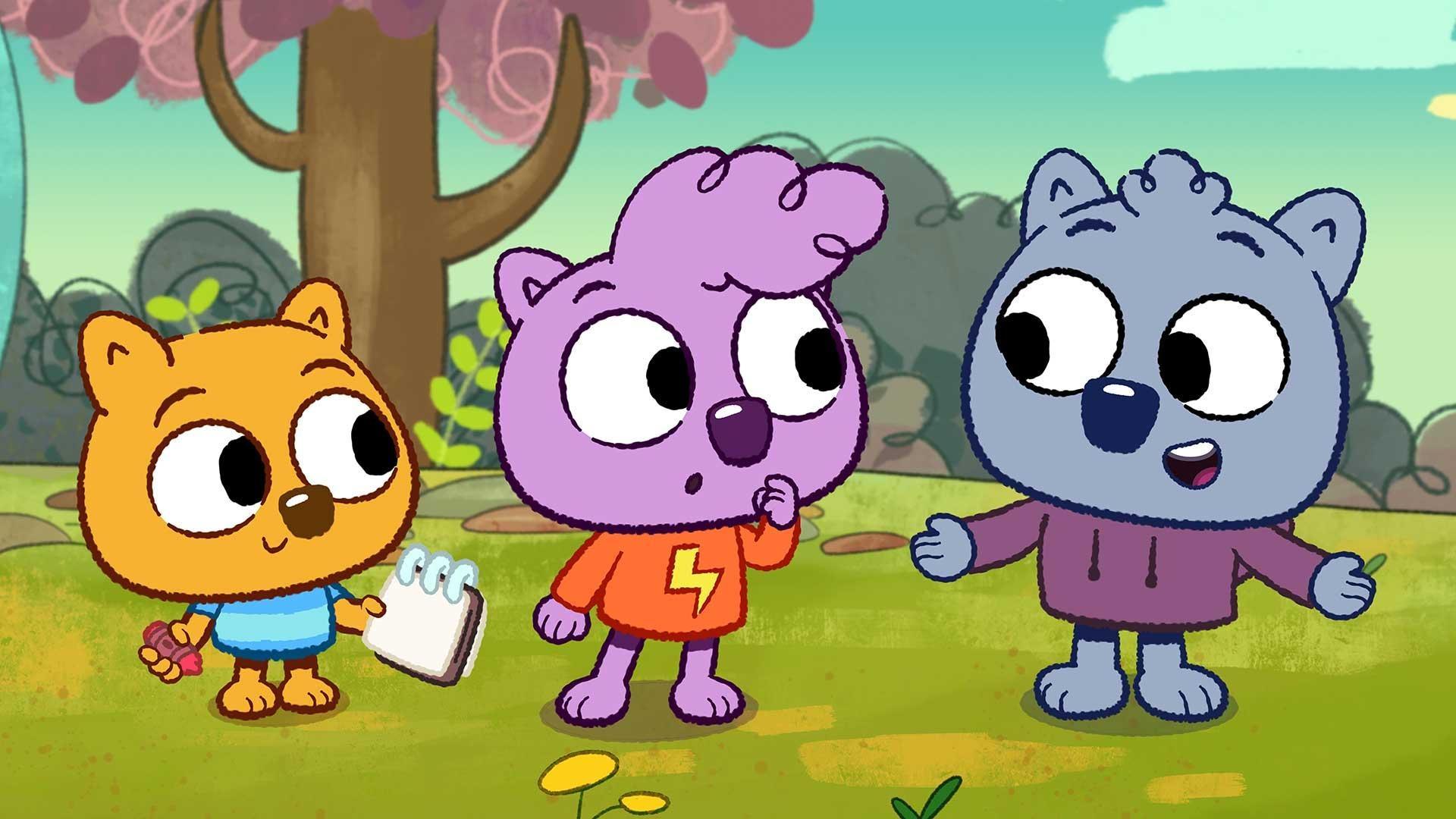 Image of three cartoon wombats - one yellow, one pink, and one blue - talking and smiling. 