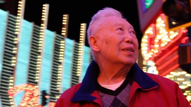 Ten Times Better: George Lee looking to his left in front of the Binion's casino lights on Fremont Street