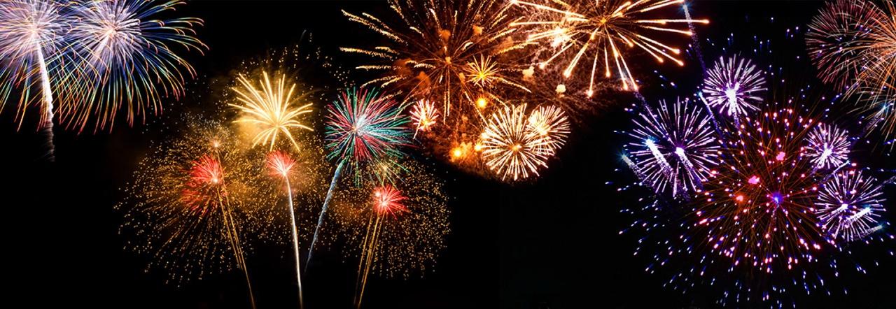 multicolored fireworks exploding against a dark sky