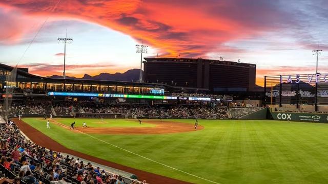 Las Vegas Aviators baseball stadium at sunset with dramatic, red-tinged sky in background