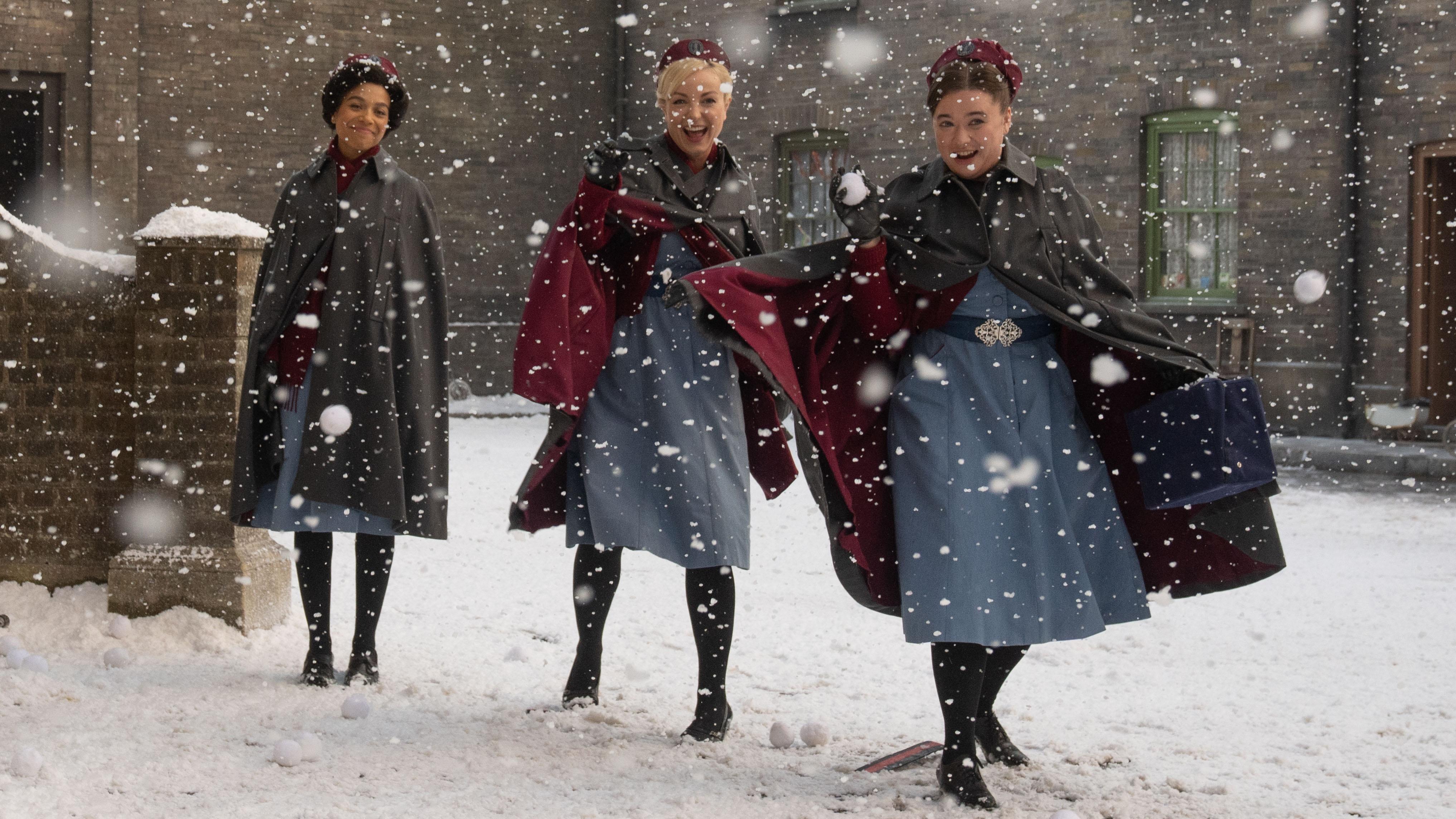 three midwives throw snowballs at the camera