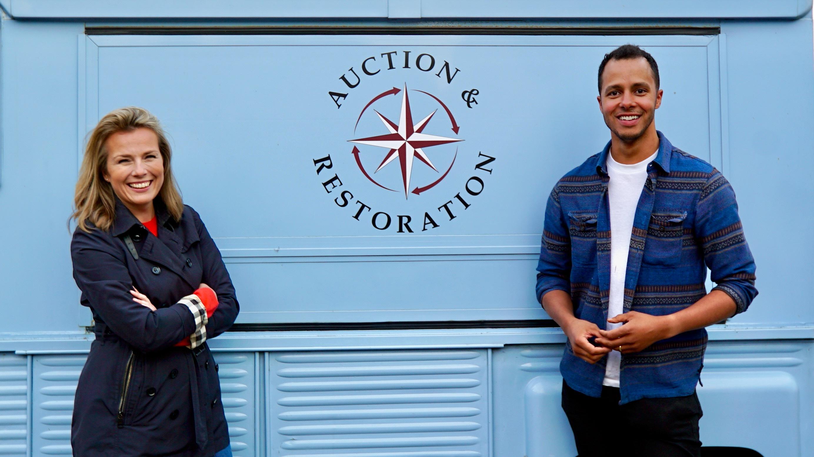 Christina Trevanion and Will Kirk standing in front of their auction vehicle