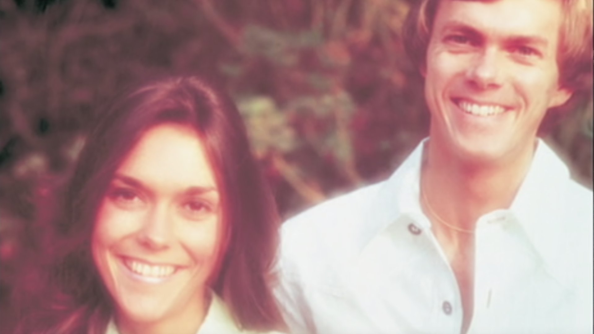 Karen and Richard Carpenter smiling at the camera.