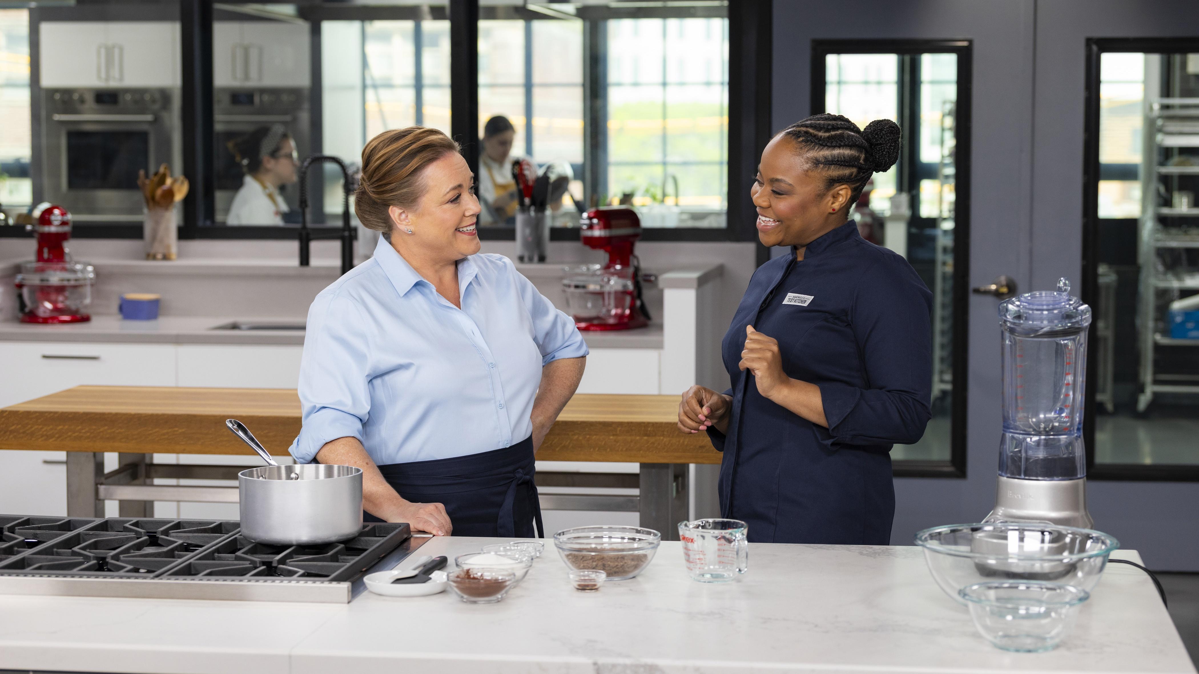2 Test Cooks standing in a kitchen
