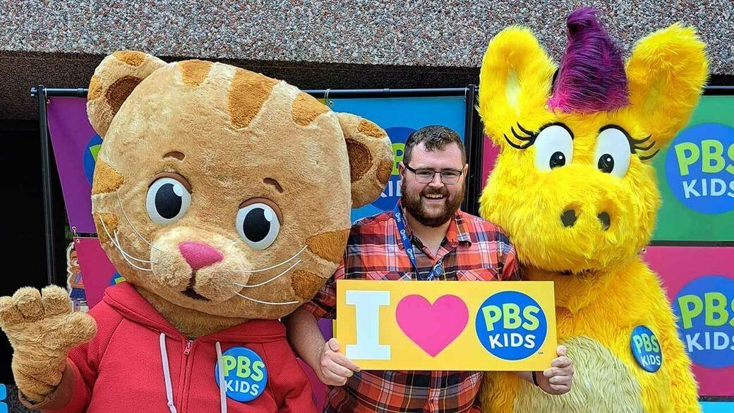 PBS intern, Bryan Frye, with Daniel Tiger and Donkey Hodie on PBS KIDS Day 2023