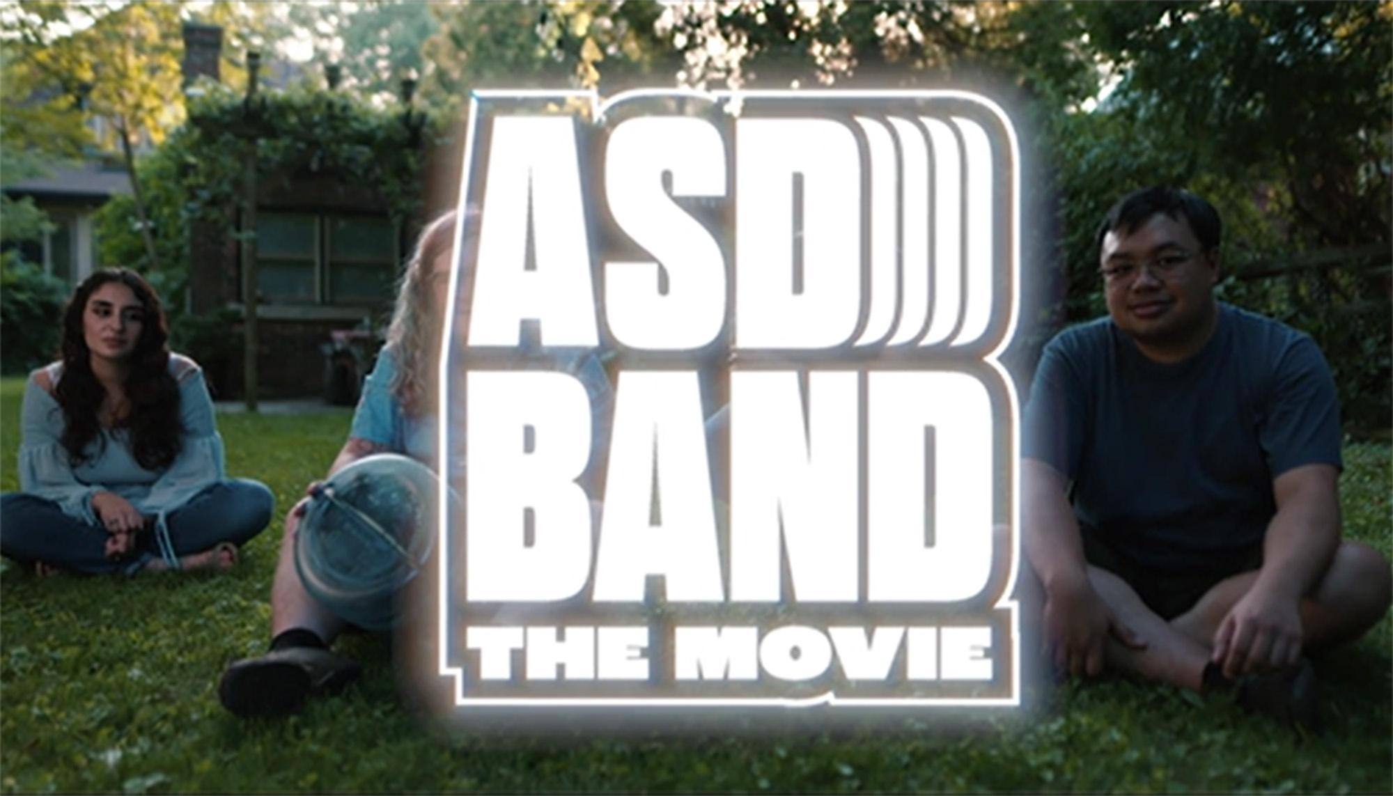ASD Band: The Movie title in front of the members of the band sitting on grass.