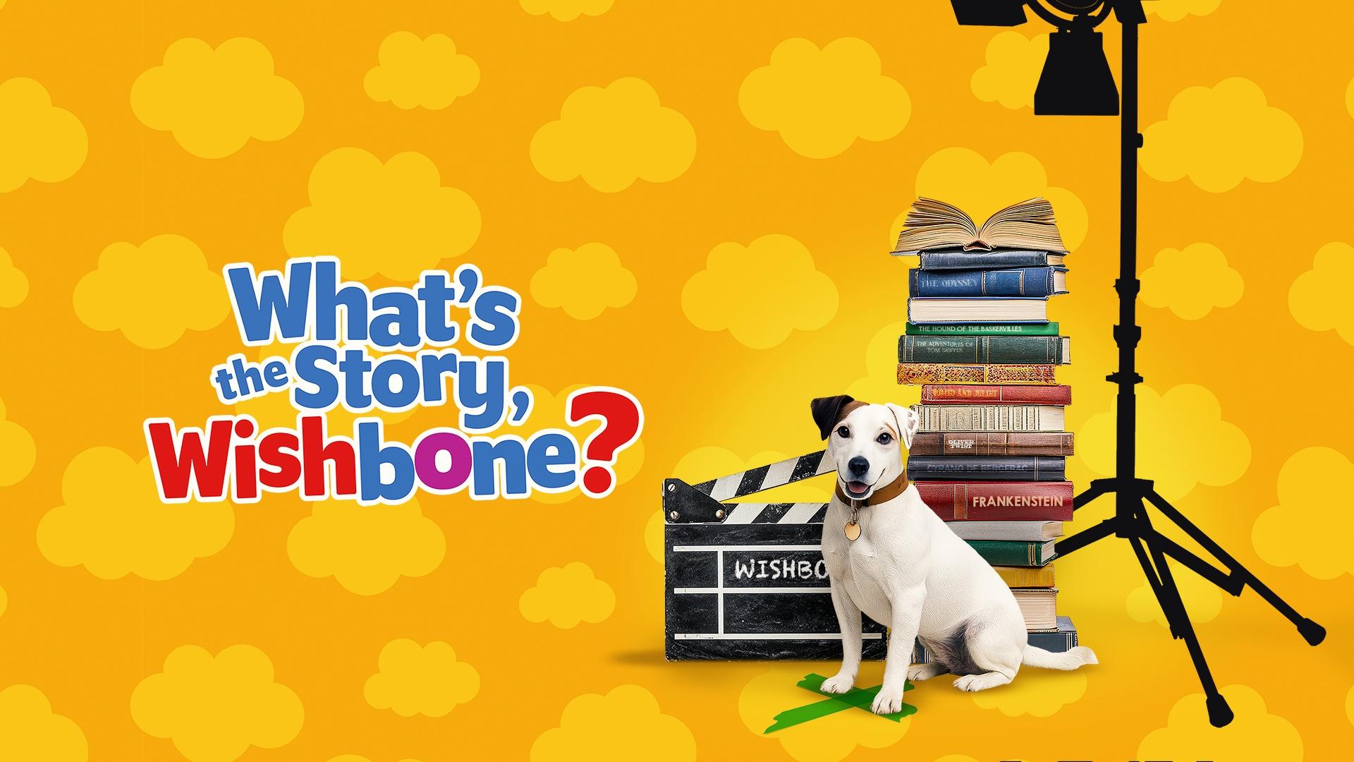 Wishbone, the Jack Russel Terrier sits in front of a pile of books.