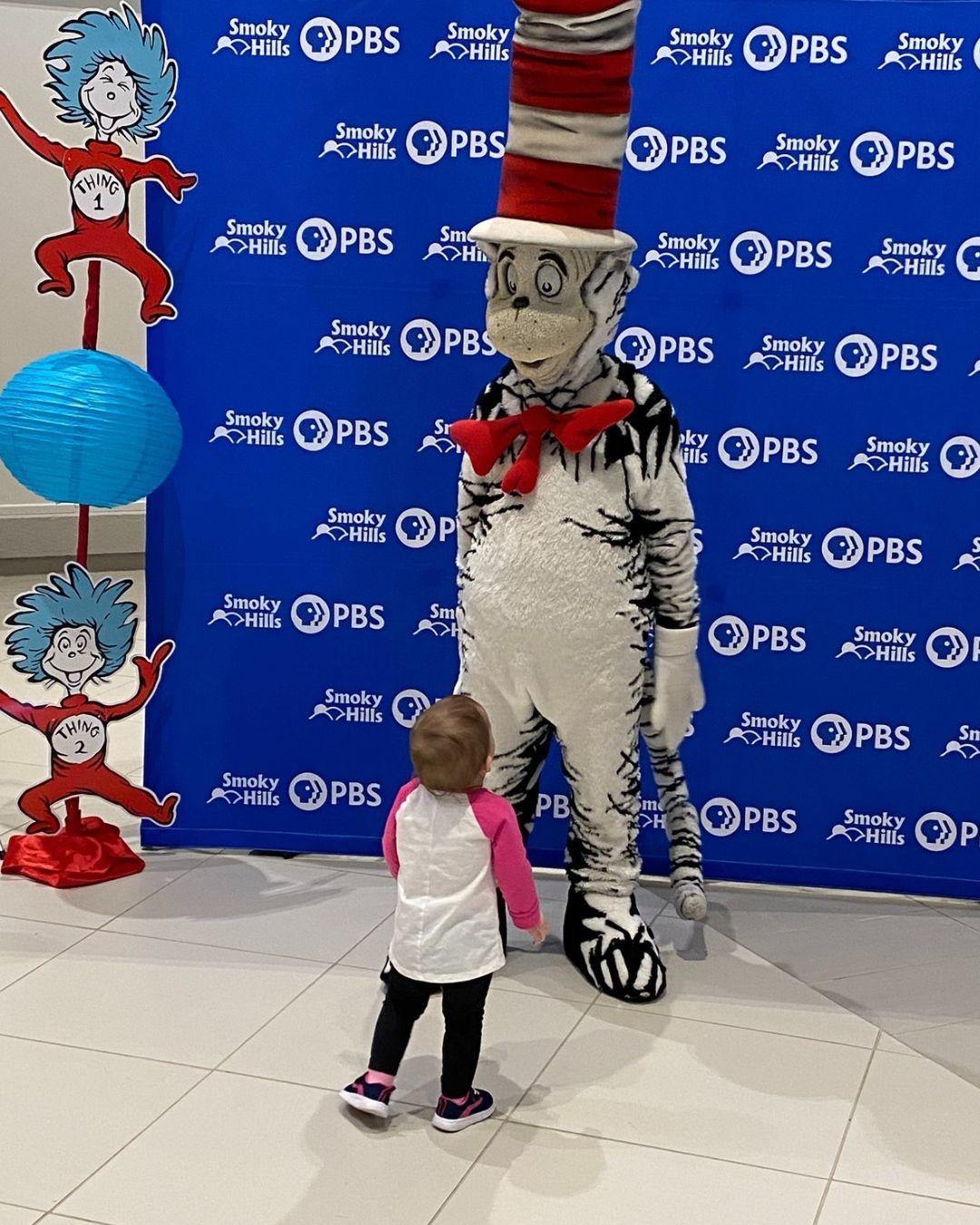Cat in the Hat looking at Girl
