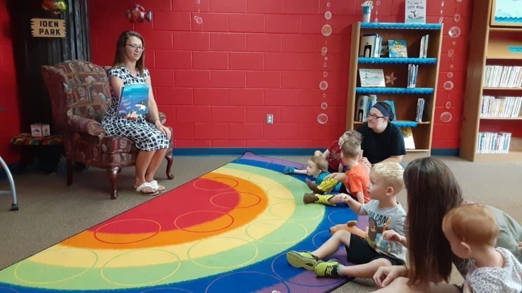 Reading a book at Share a Story Program