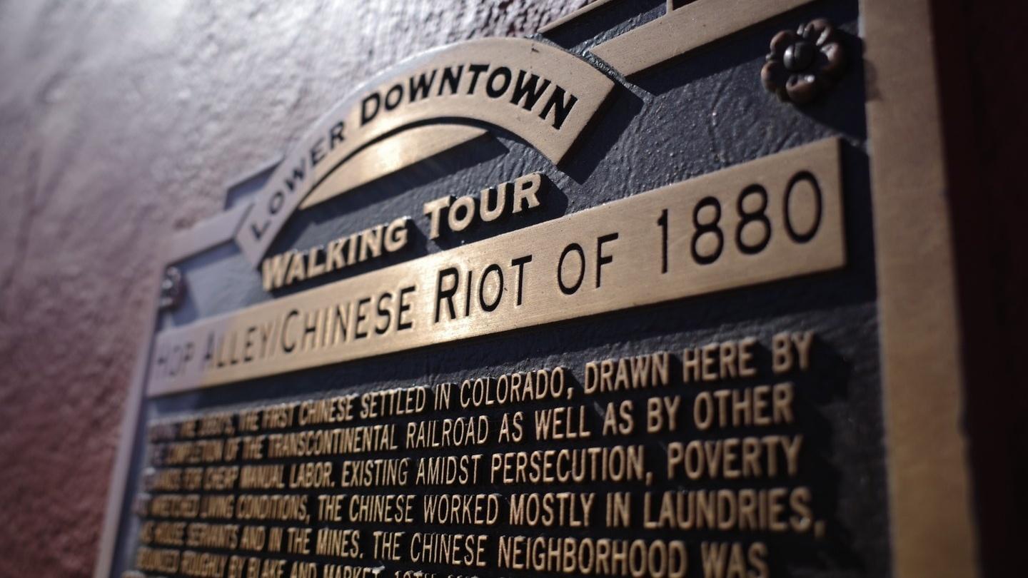 At the intersection of 20th and Blake streets in Denver, a plaque details Denver's 1880 anti-Chinese race riot. The plaque has drawn criticism for historic inaccuracies, sanitizing violence and over-emphasizing Chinese drug use.