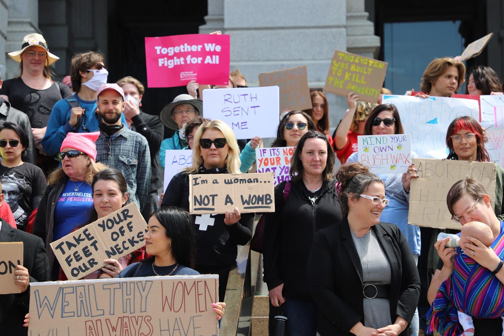 A group of Coloradans rally on the steps of the State Capitol Tuesday, May 3 in support of safe, accessible and legal abortions. The rally was organized after Politico published a draft opinion from the Supreme Court showing the court's conservative majority intends to reverse Roe v. Wade.