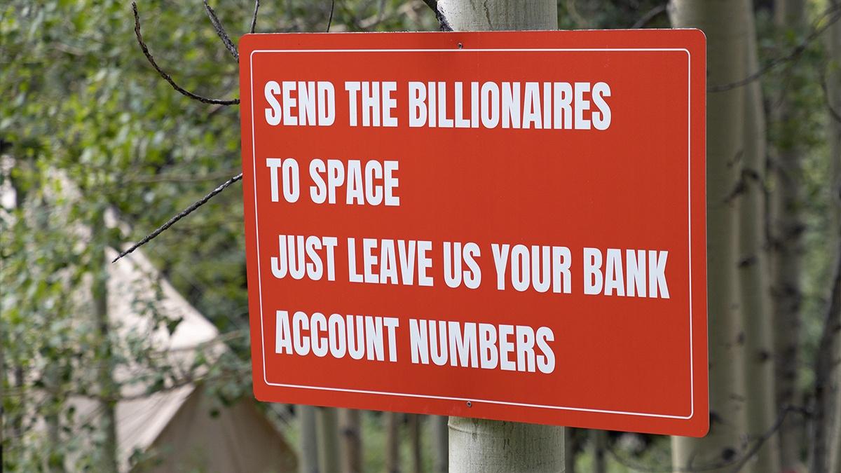 A new art exhibit in Aspen has a clear message: billionaires should try to heal Earth, not escape it.