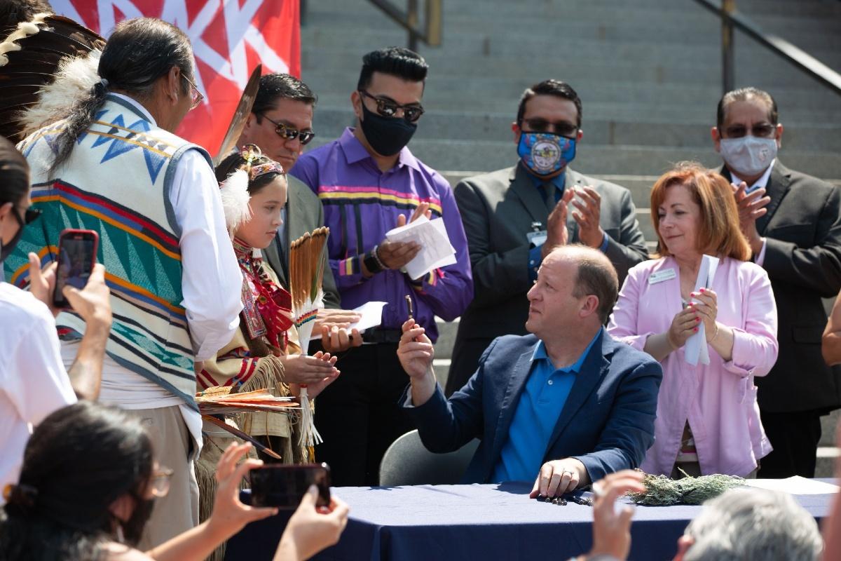 Governor Polis signs an executive order rescinding a proclamation from Territorial Governor John Evans that led to horrific violence against Native Americans.