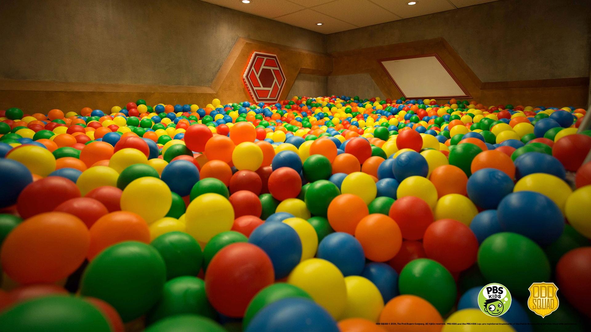 Image from Odd Squad - room full of balls.  