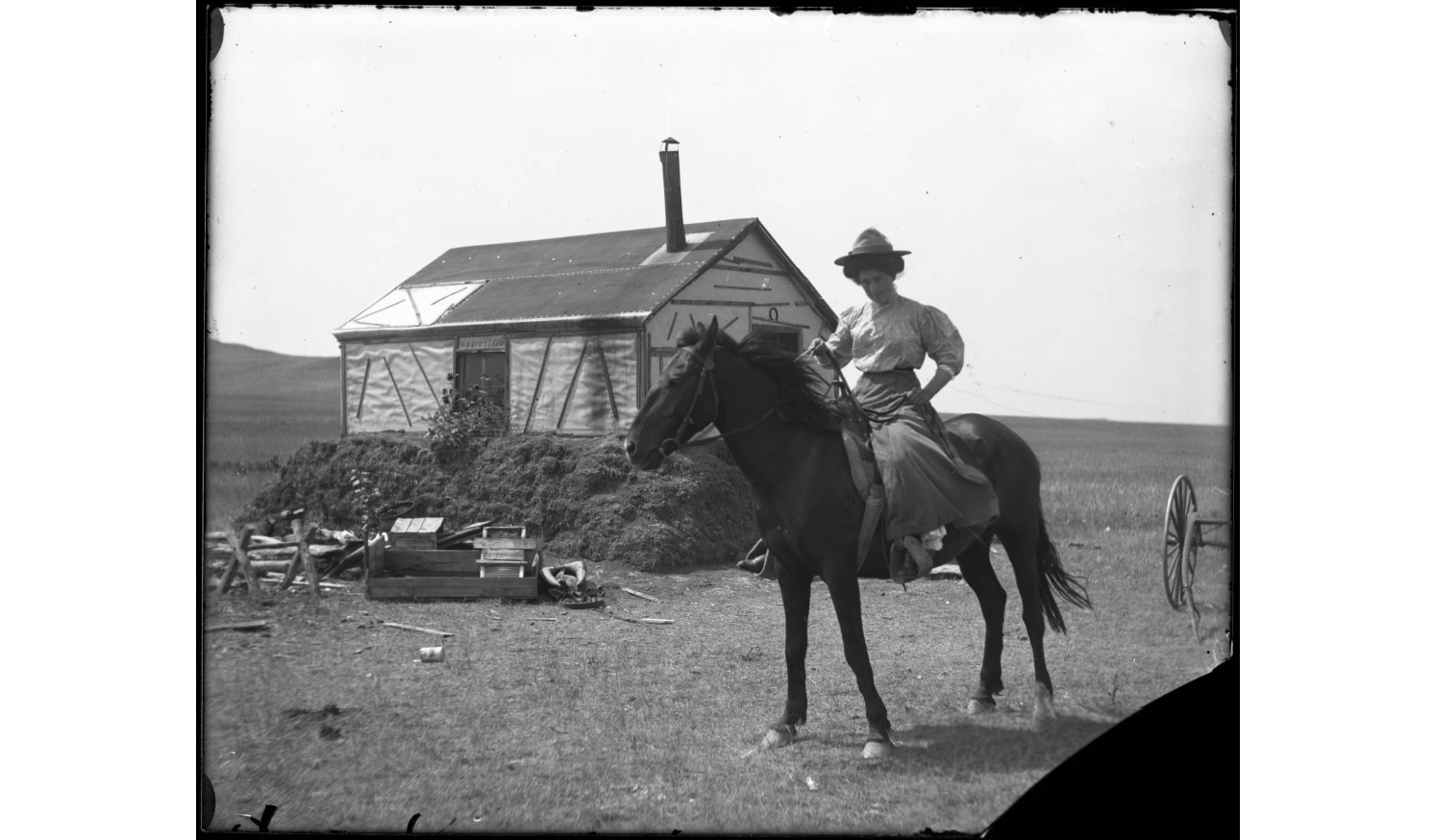 woman with horse at homesteaders shack