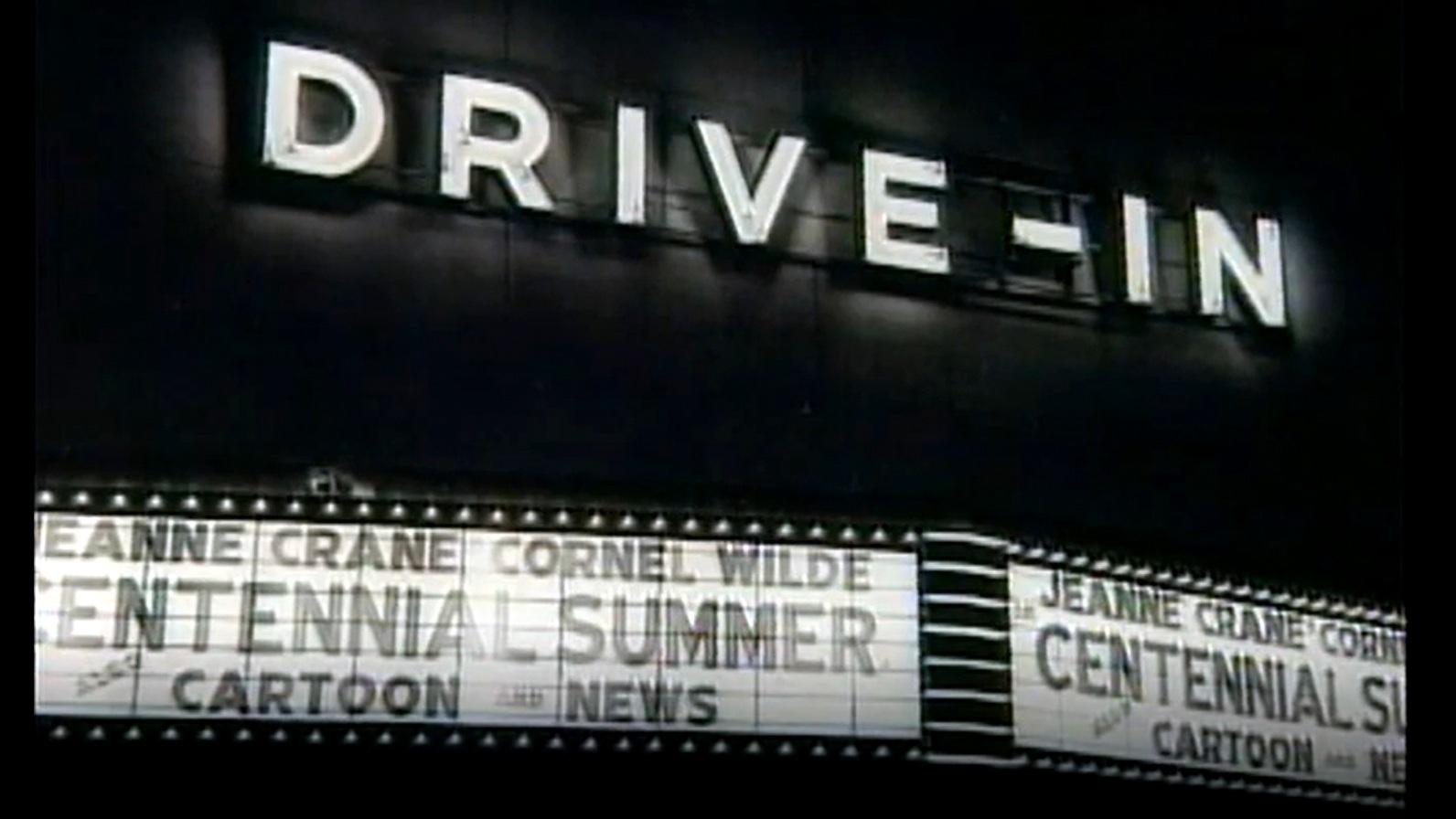 Drive-In theater sign at night.