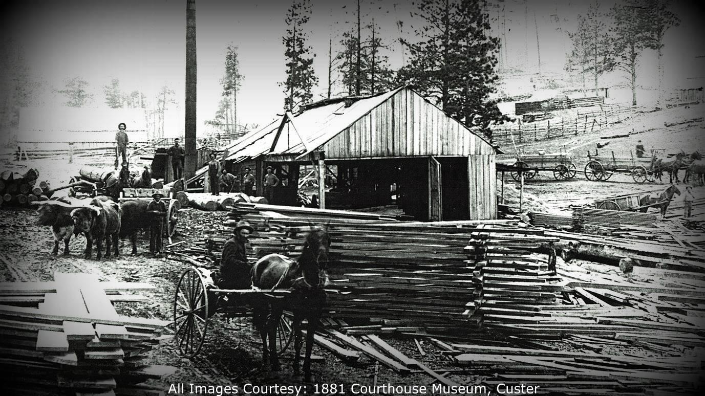 Archival photo of an old lumber mill. 