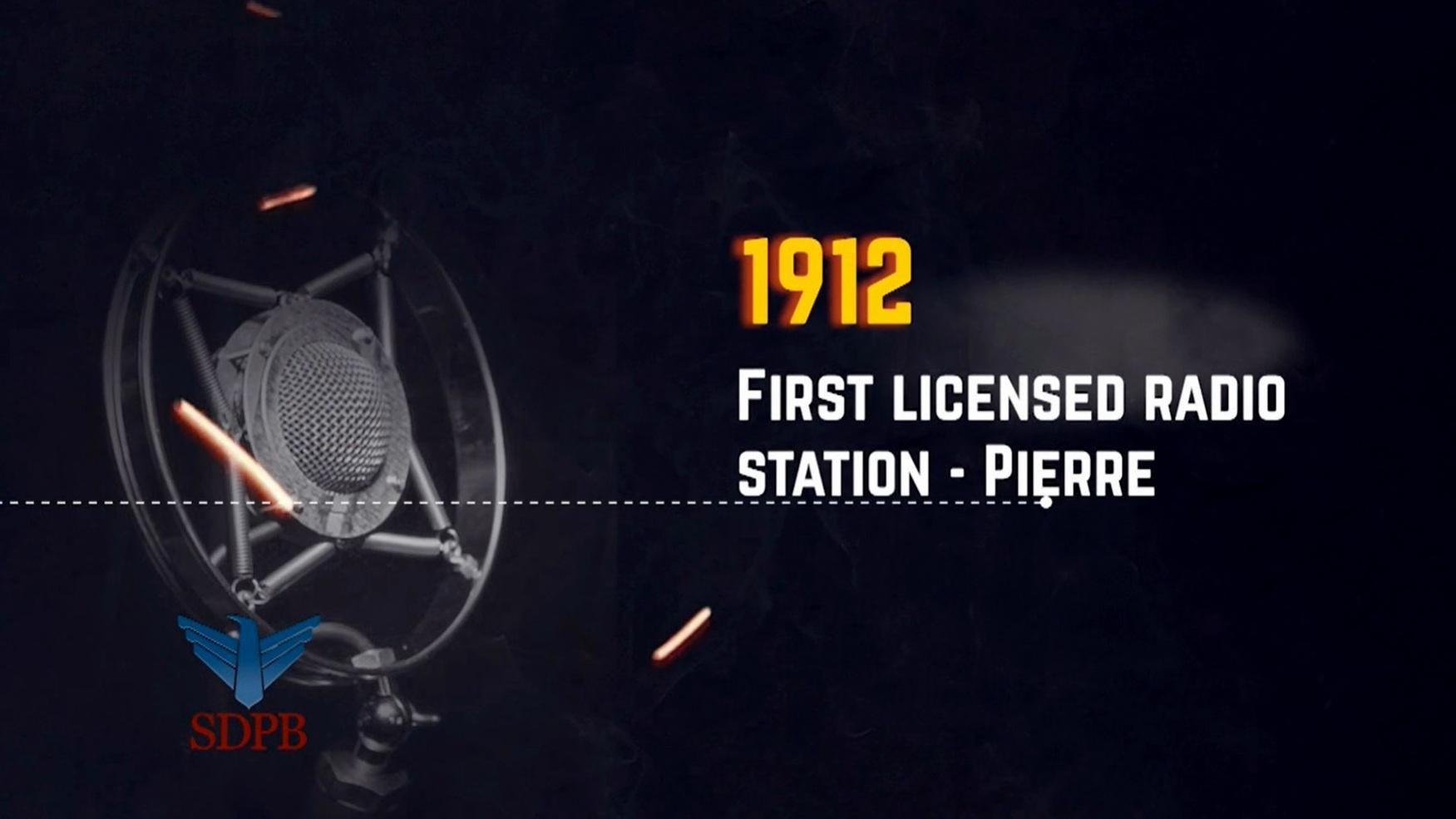 Decorative logo for the Middle of Everywhere documentary, an older microphone is sitting next to the words, First Licensed Radio Station - Pierre, 1912.
