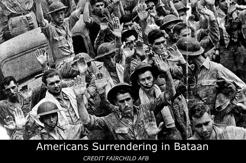 Archival photo of American Soldier surrendering in Bataan. 