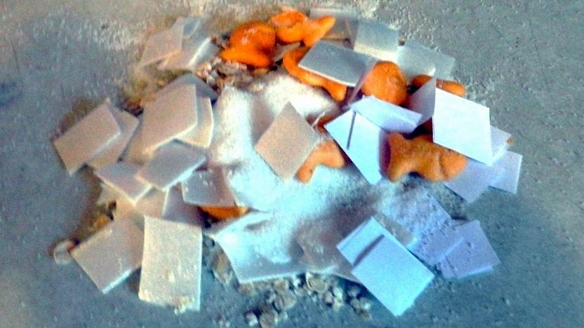 Photo of activity - a pile of items like square pieces of paper, Goldfish crackers, salt, sugar, and pepper all mixed together. 