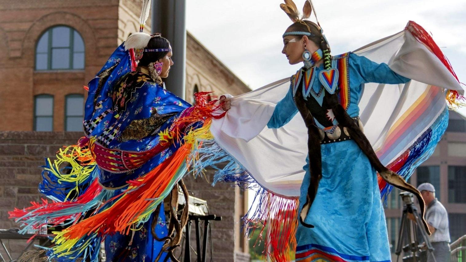 Two female Native American dancers. 