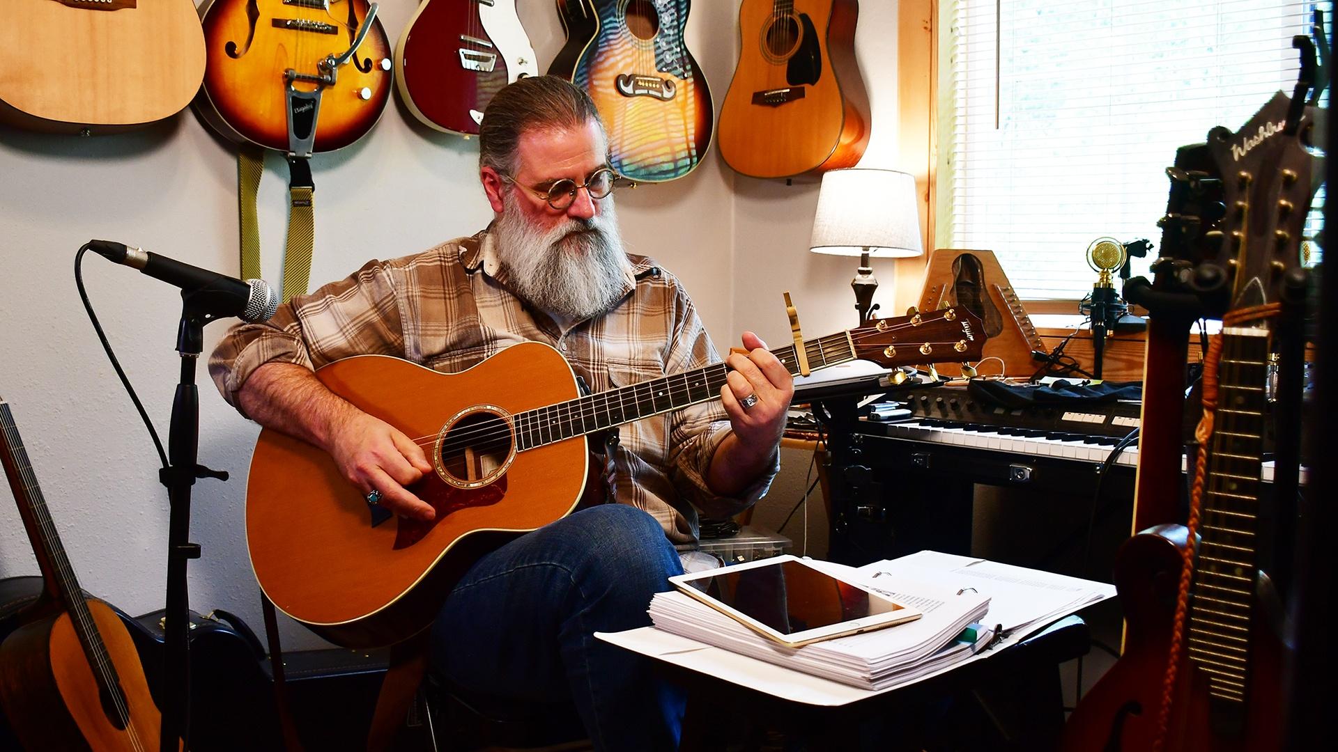 scott simpson with a guitar