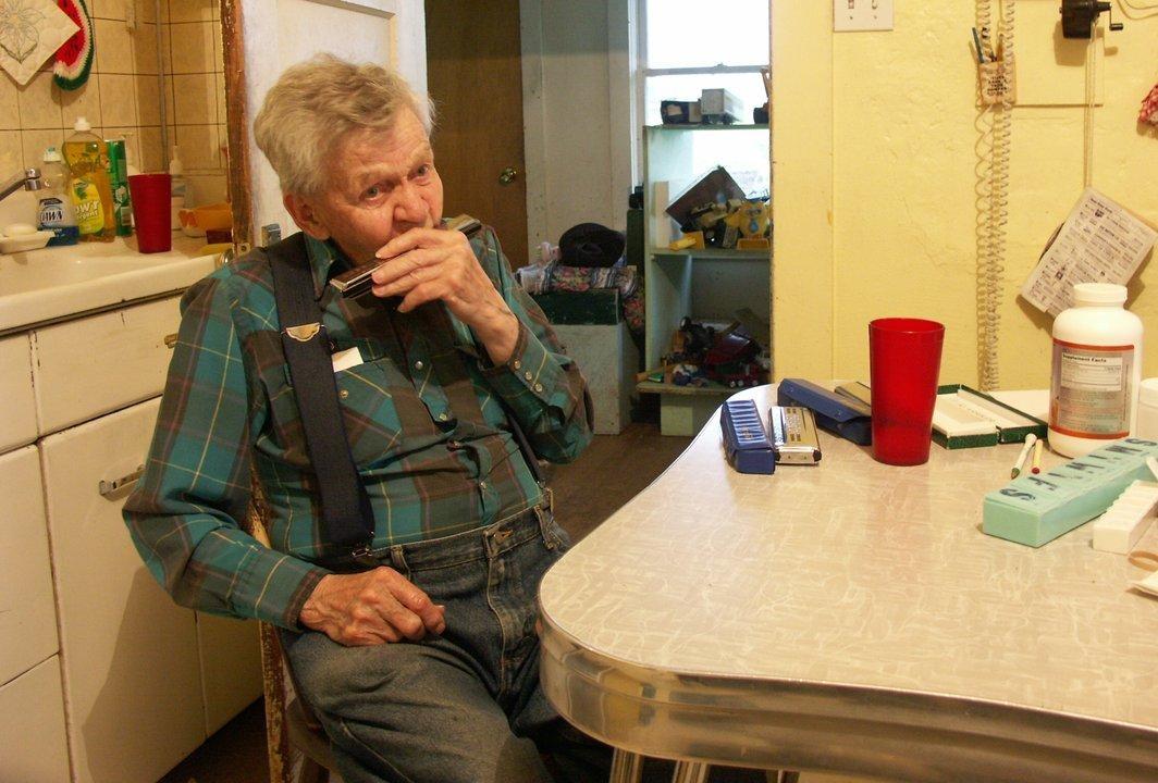 Clarence "Harmonica Man" Rostad, retied rancher