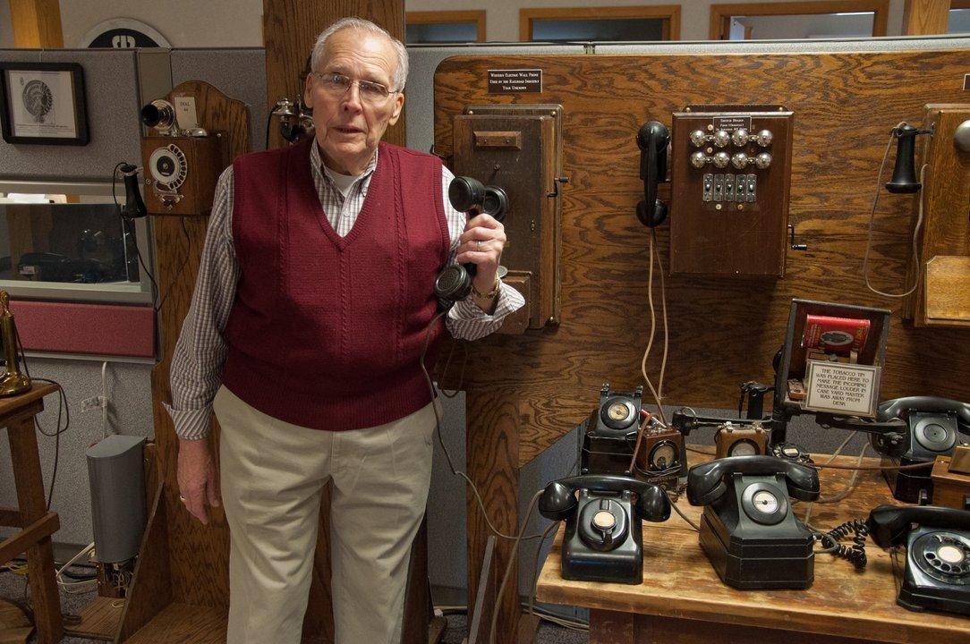 Frank Gebhardt with his collection of phones