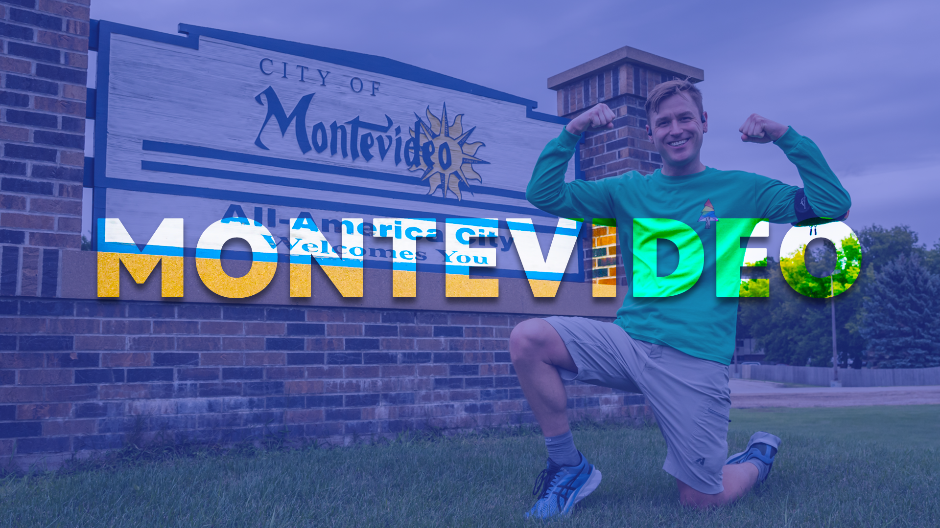 Photo of Mikah Meyer flexing his biceps in front of the City of Montevideo sign.