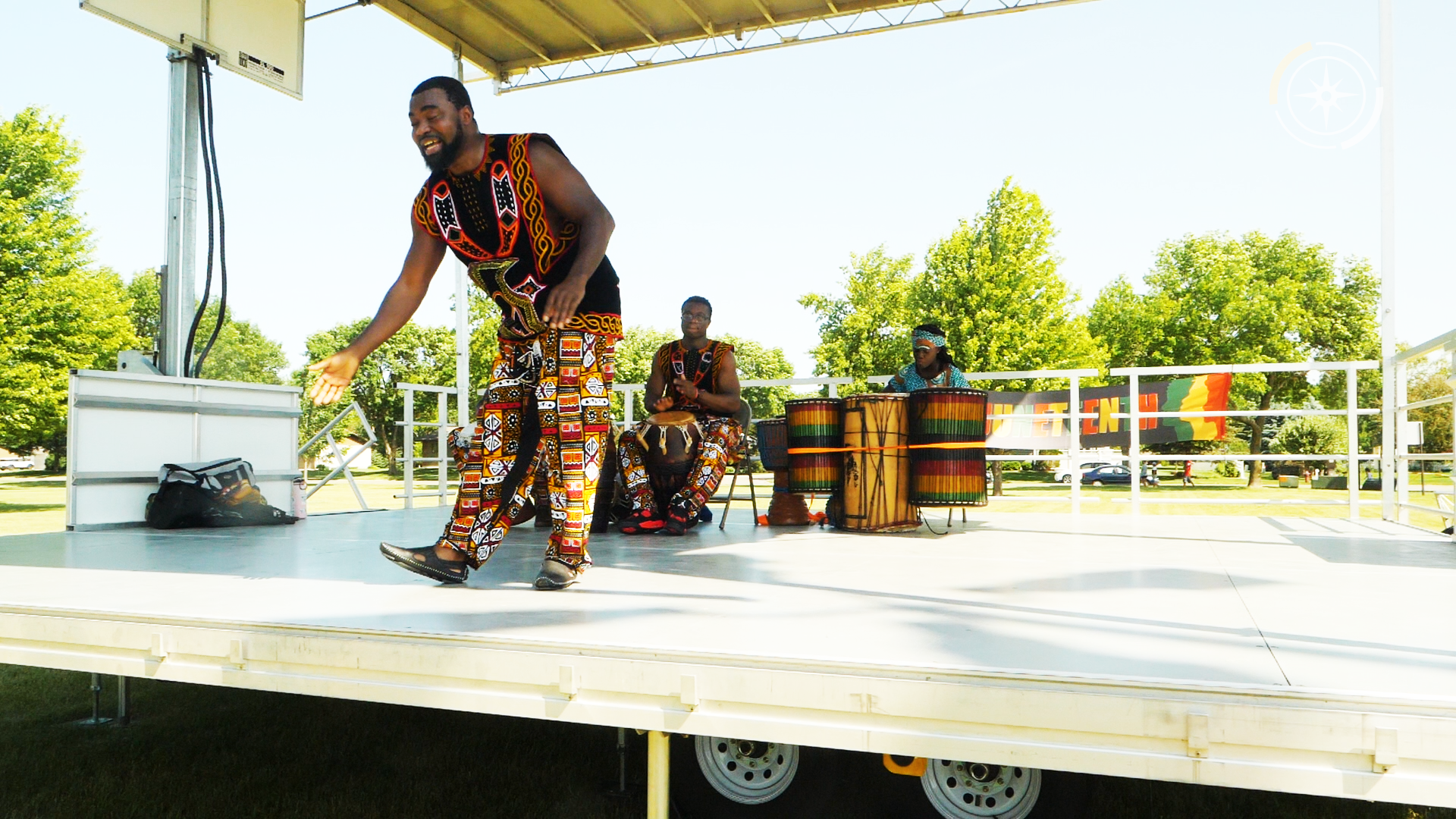 Christian Adeti from the Titambe West African Dance Ensemble of Minnesota leads dancing in the park