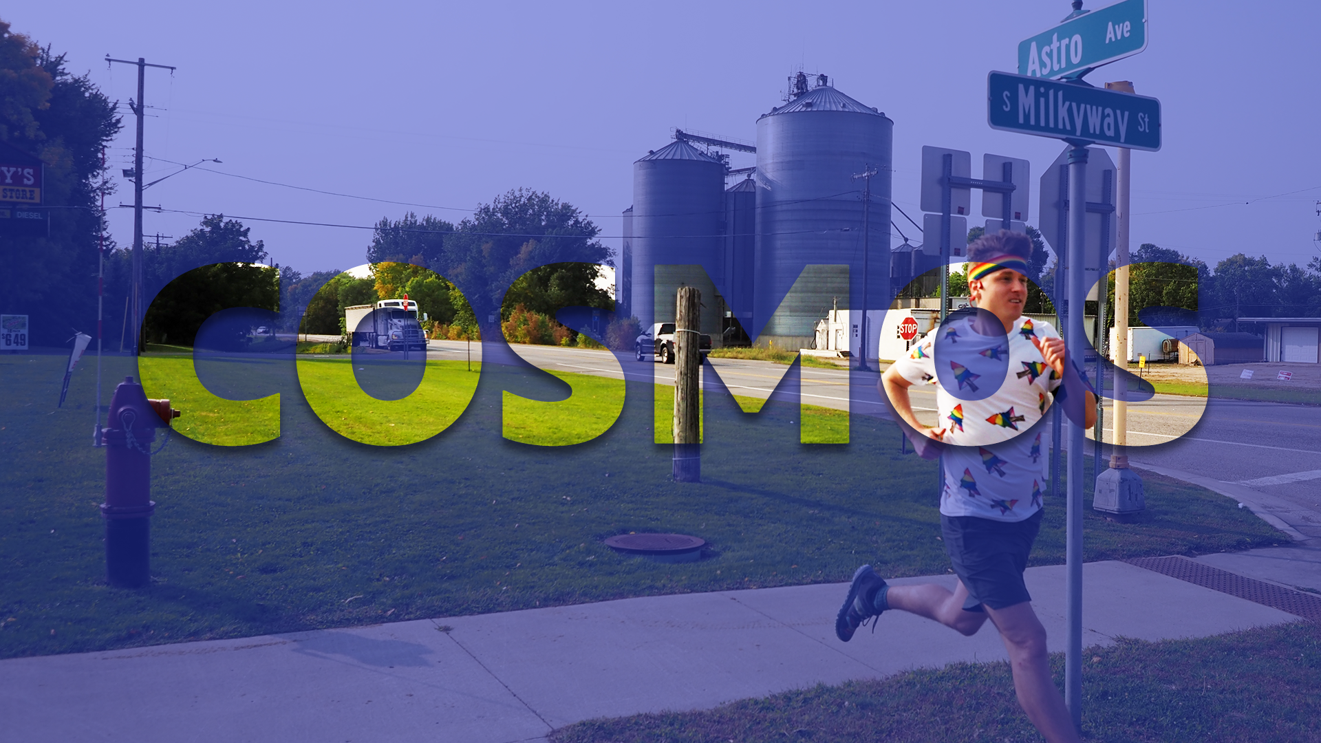 Photo of Mikah Meyer running by two street signs that say "Astro Ave" and "S. Milkyway St." in Cosmos.