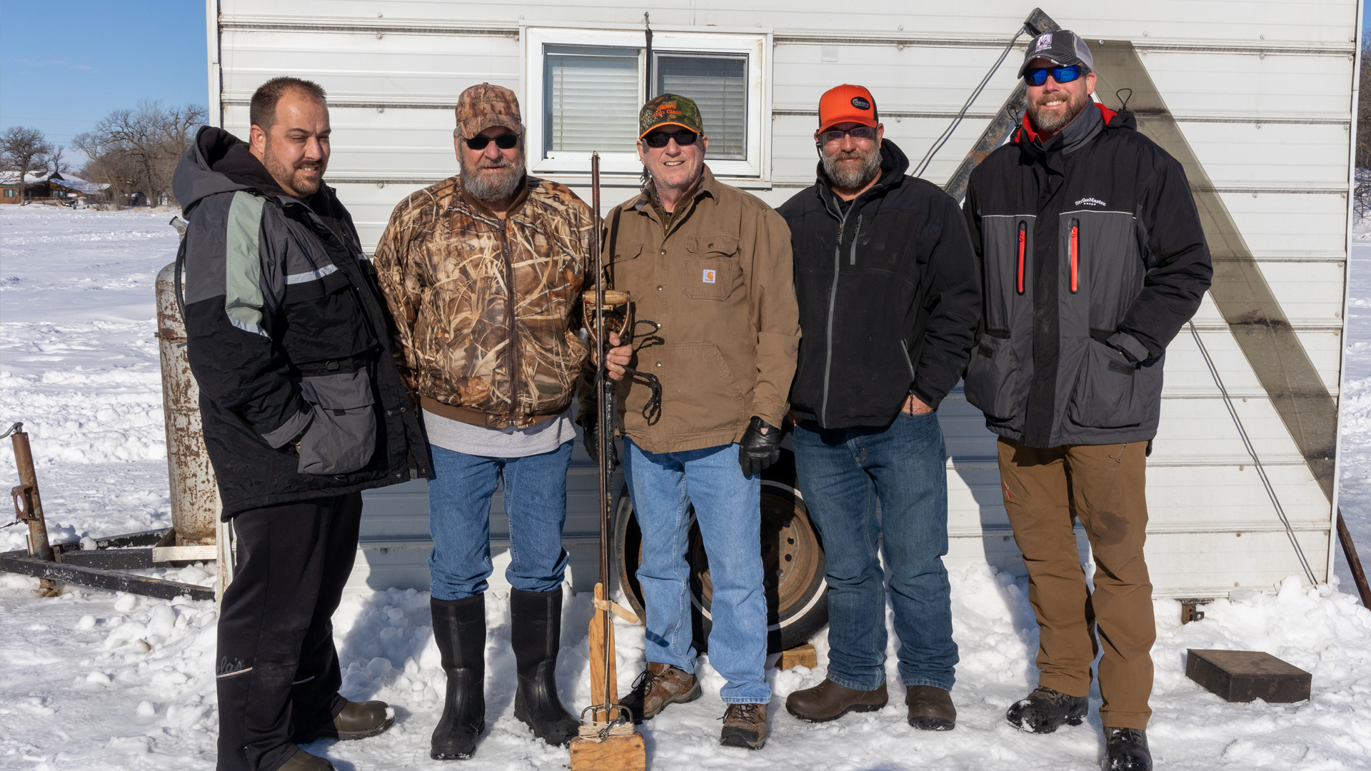 Bret Amundson with Glen Tomoson sons Dustin, Glen, Eric and his brother Jim at a dark house on Lake Geneva near Alexandria.