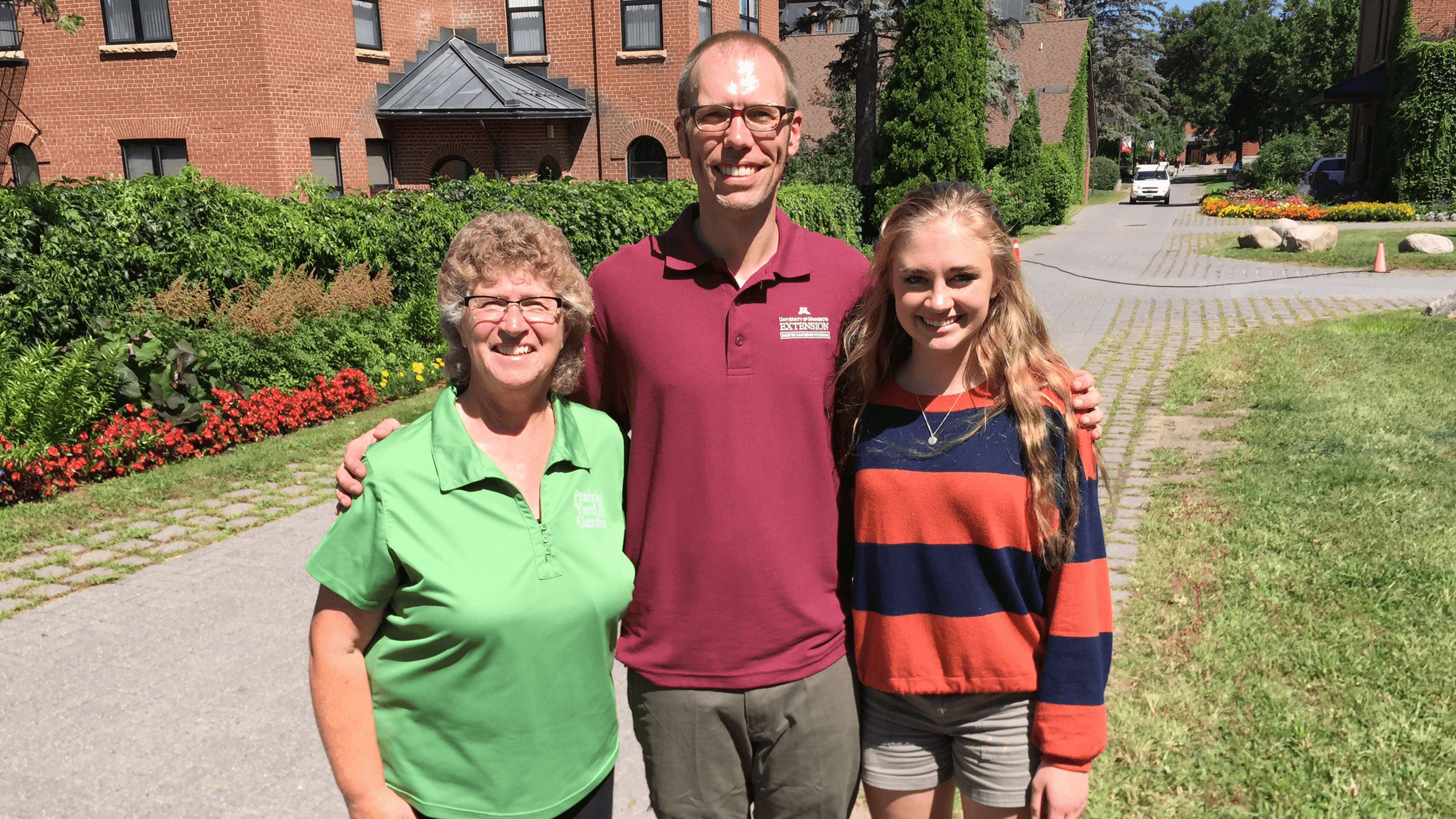 Mary Holm visits with Dr. Joe Storlien, soil scientist from the College of Saint Benedict.