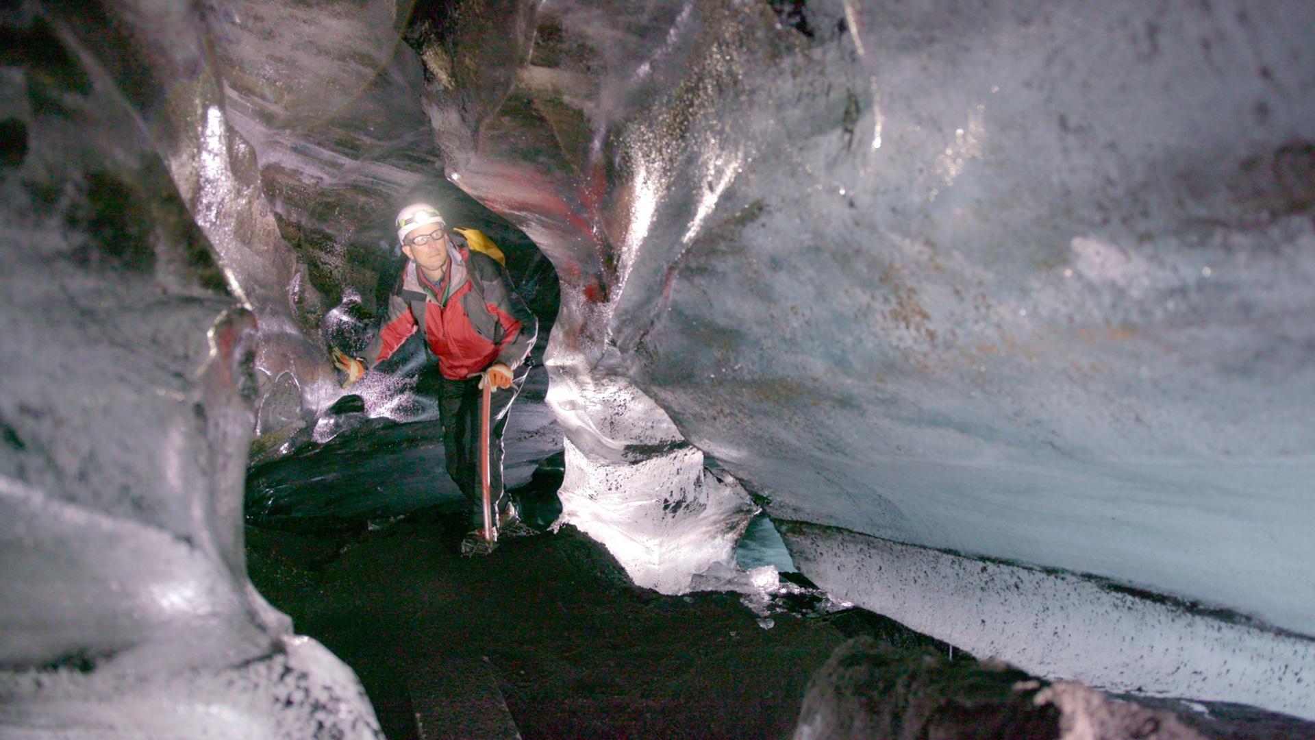 Geologist Stephen Mojzsis explores an ice cave. Stephen says, "life has perpetuated the liquid water on the surface of our planet, for geologic time".