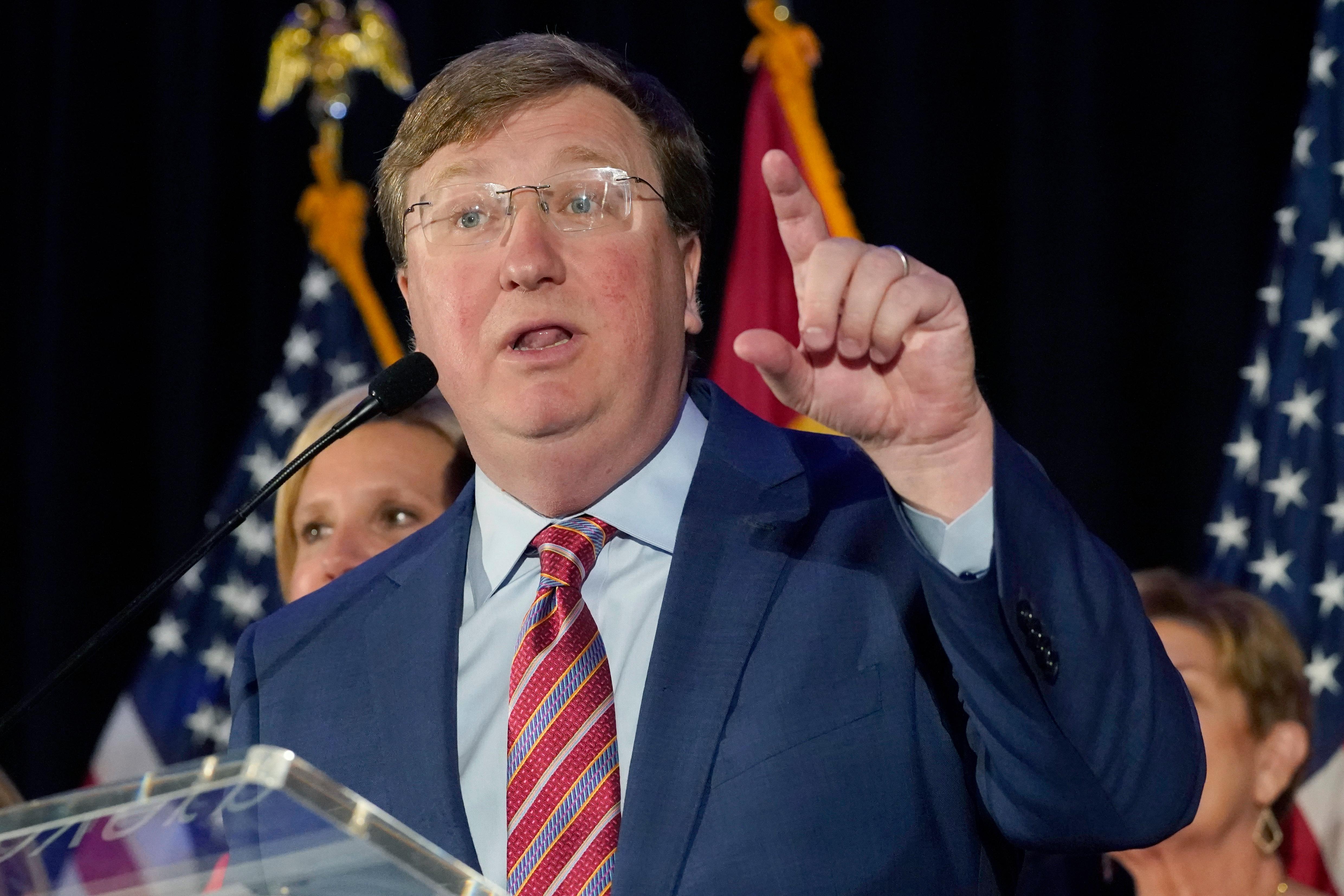 Tate Reeves stands at a podium, gesticulating as he gives a speech after the election was called.