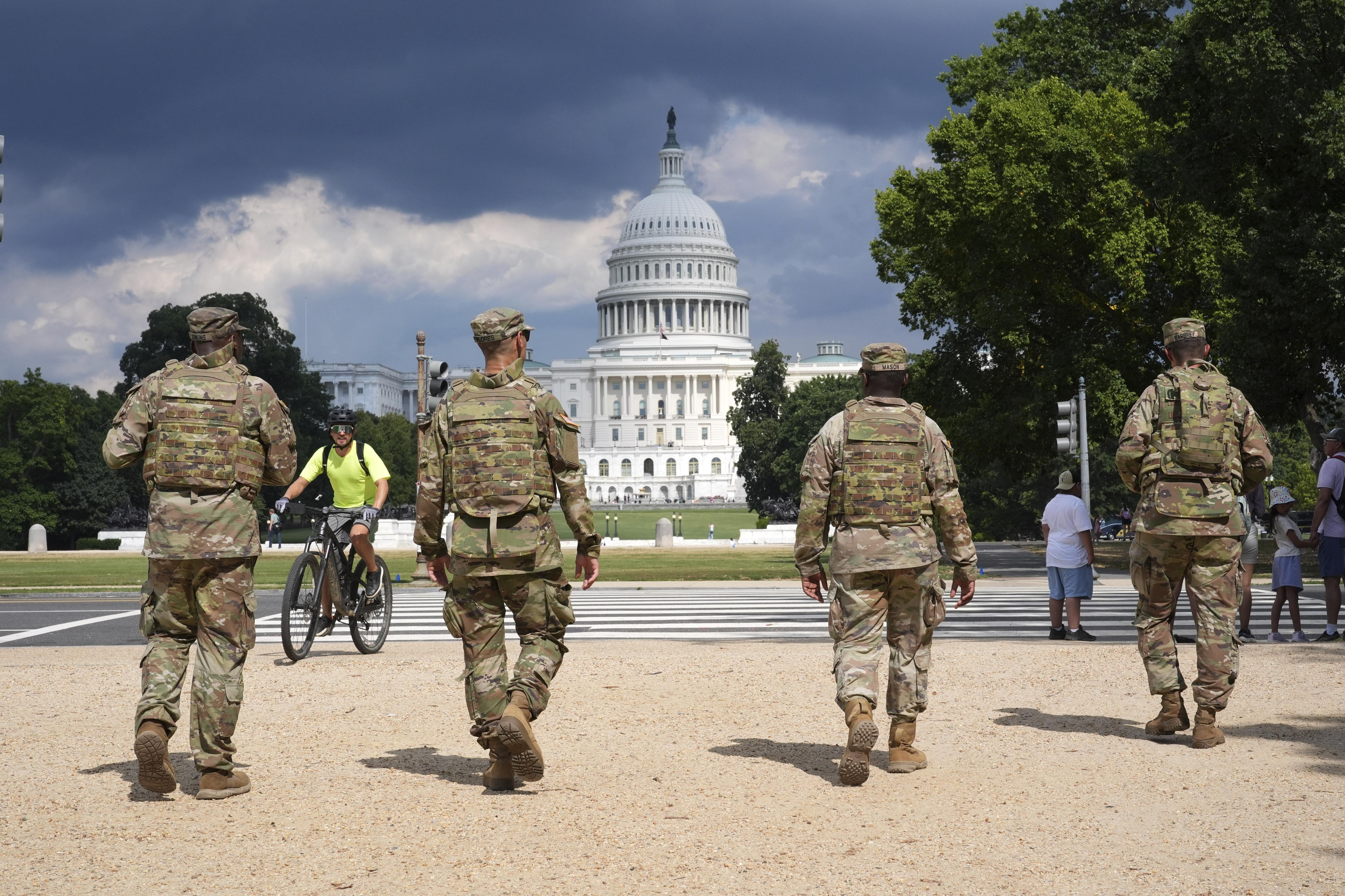 Soldiers walk on the national mall.