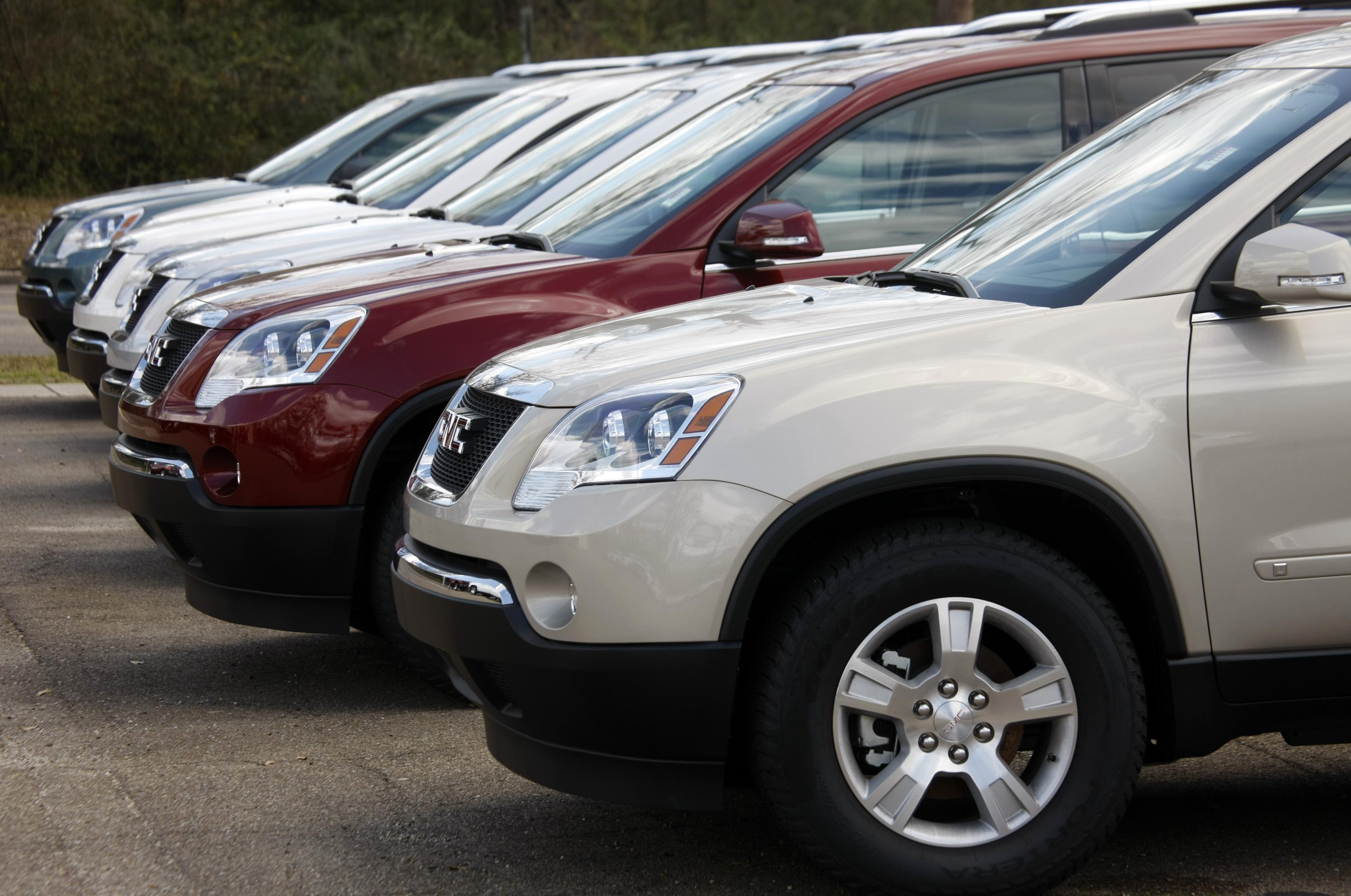 A row of SUVs is seen.