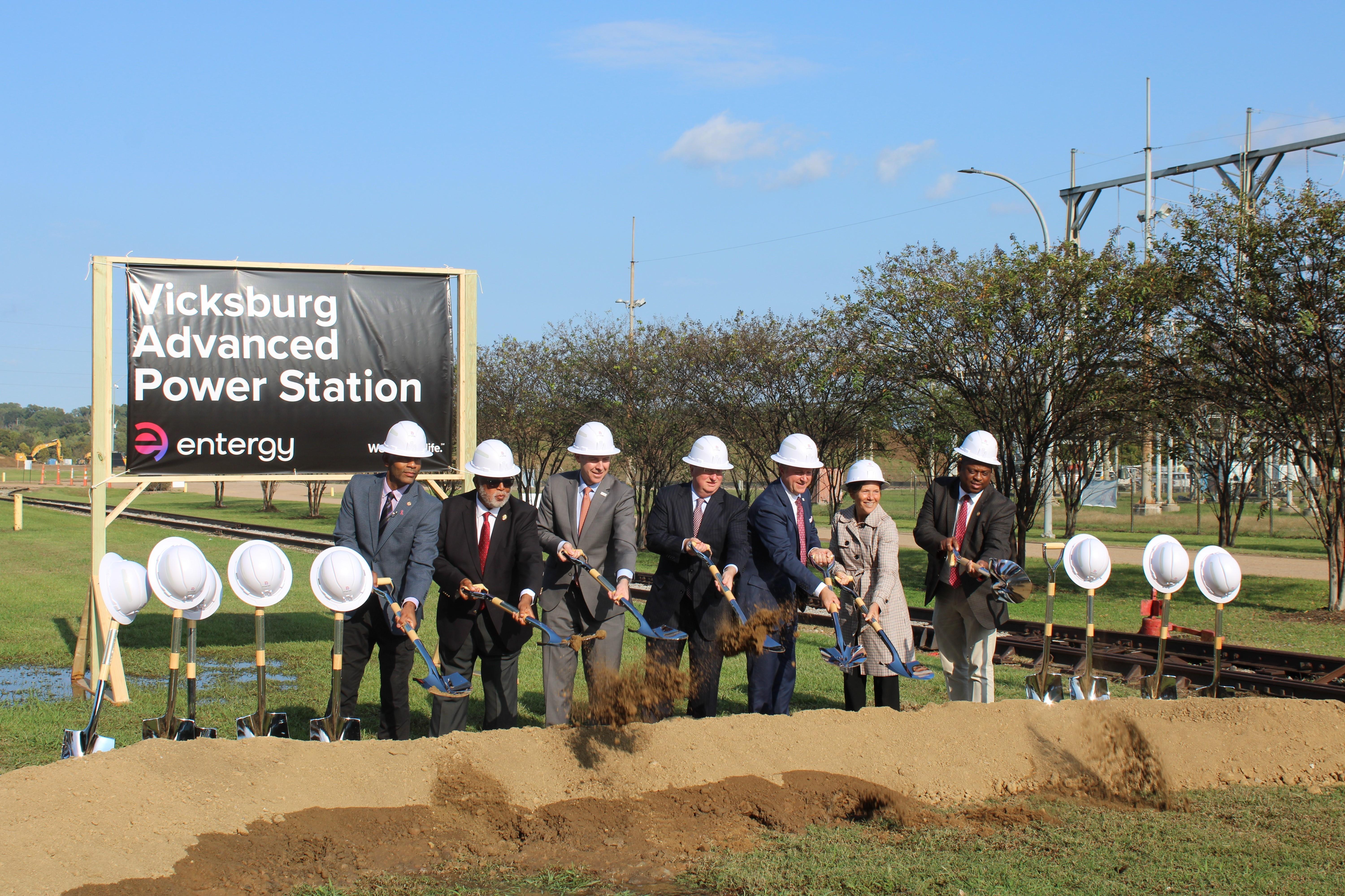 Officials lift dirt symbolically with shovels