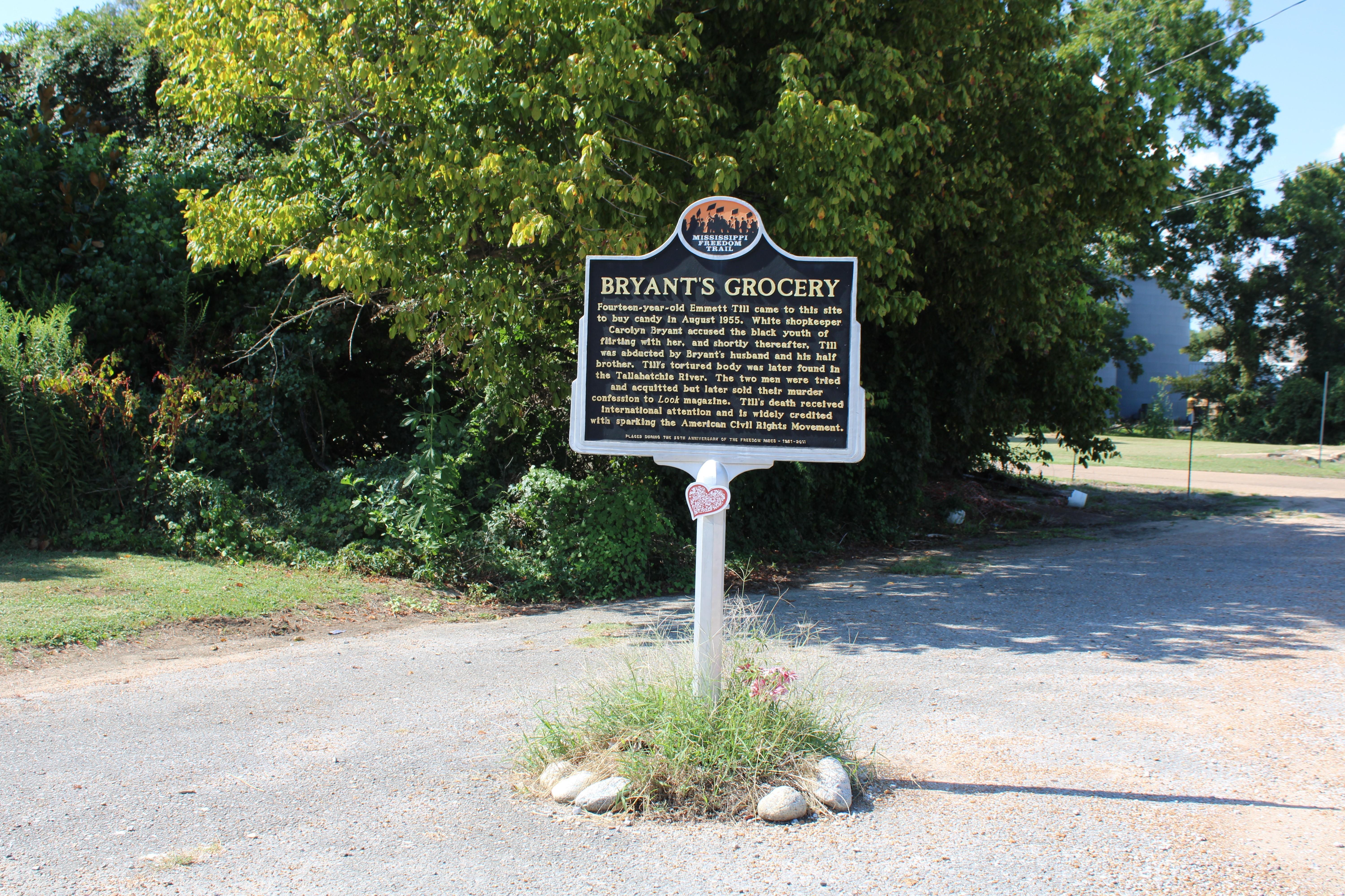 The ruins of the Bryant store is seen behind a marker.