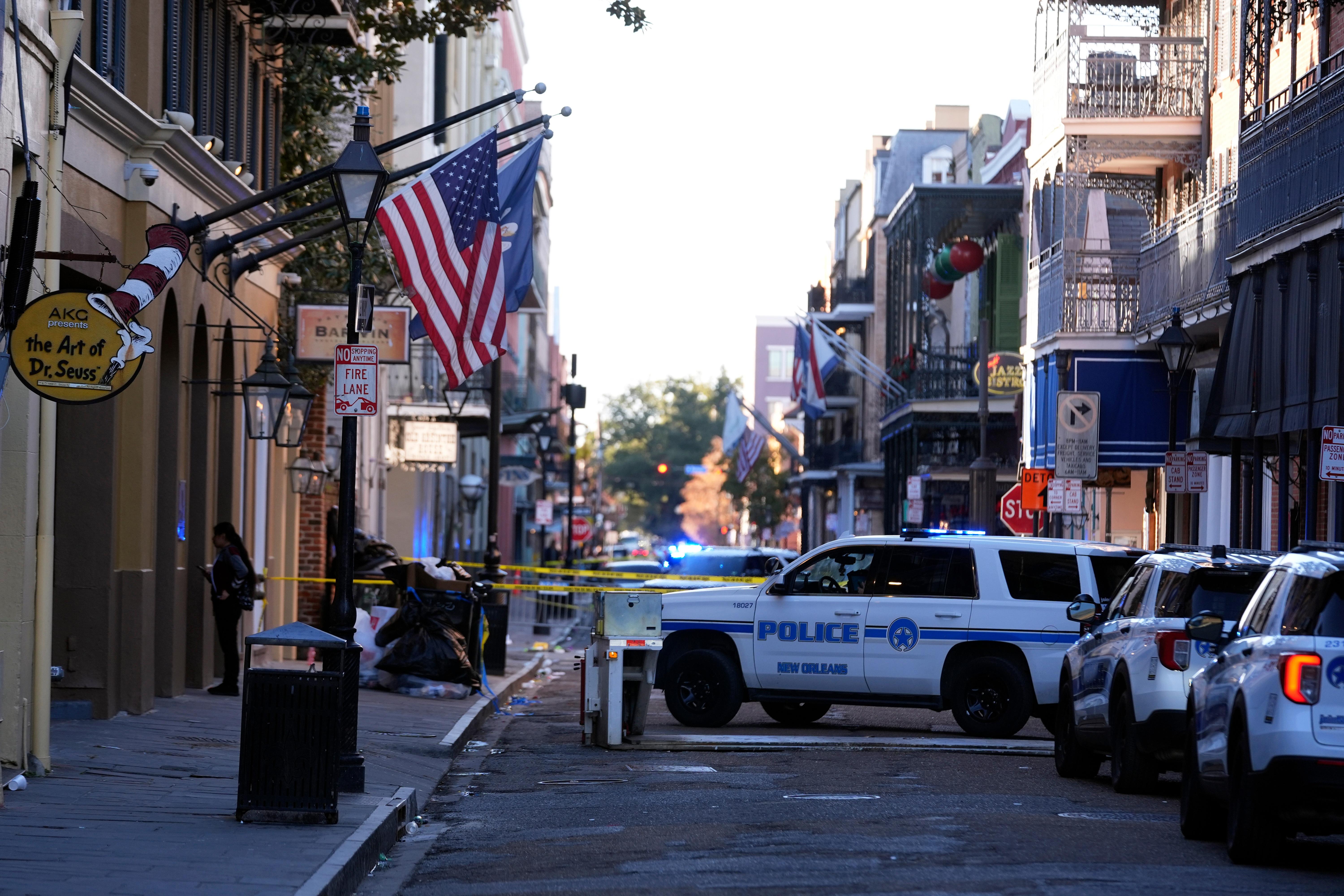 Police cars fill Bourbon Street.